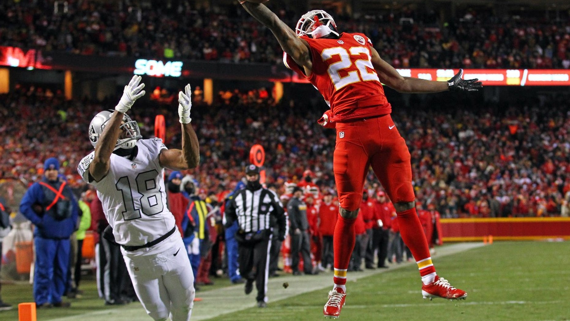 FILE -- Dec 8, 2016; Kansas City, MO, USA; Kansas City Chiefs cornerback Marcus Peters (22) breaks up a pass intended for Oakland Raiders wide receiver Andre Holmes (18) during the second half at Arrowhead Stadium.