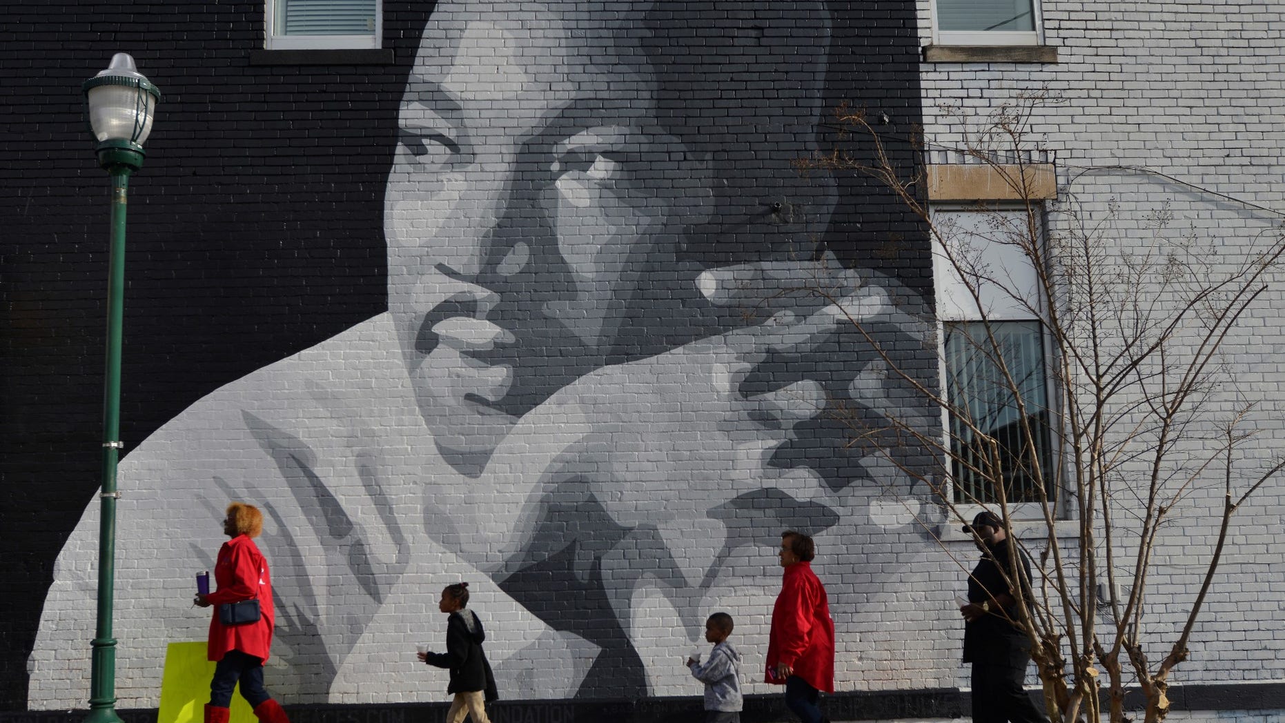 FILE -- People gather to march in the annual parade down MLK Boulevard to honor Martin Luther King.