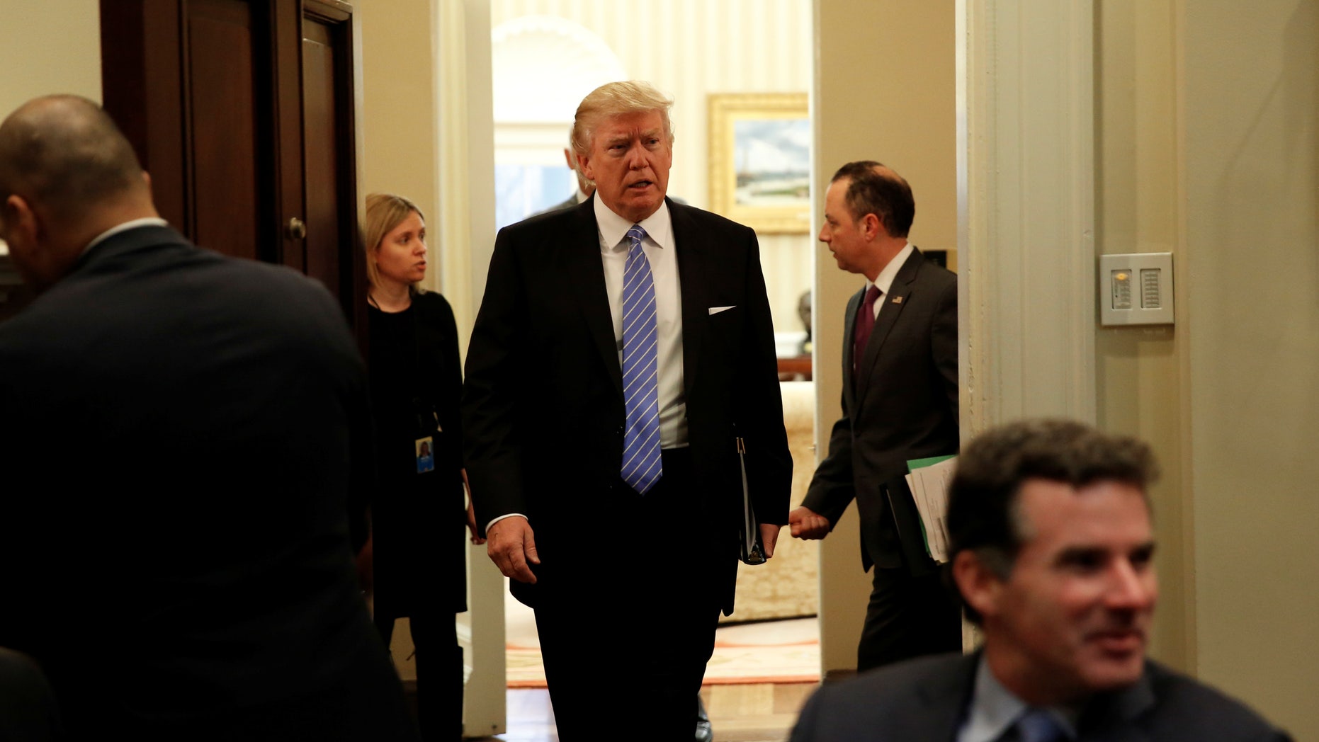 U.S. President Donald Trump arrives for a meeting with business leaders in the Roosevelt Room of the White House in Washington January 23, 2017. (REUTERS/Kevin Lamarque)