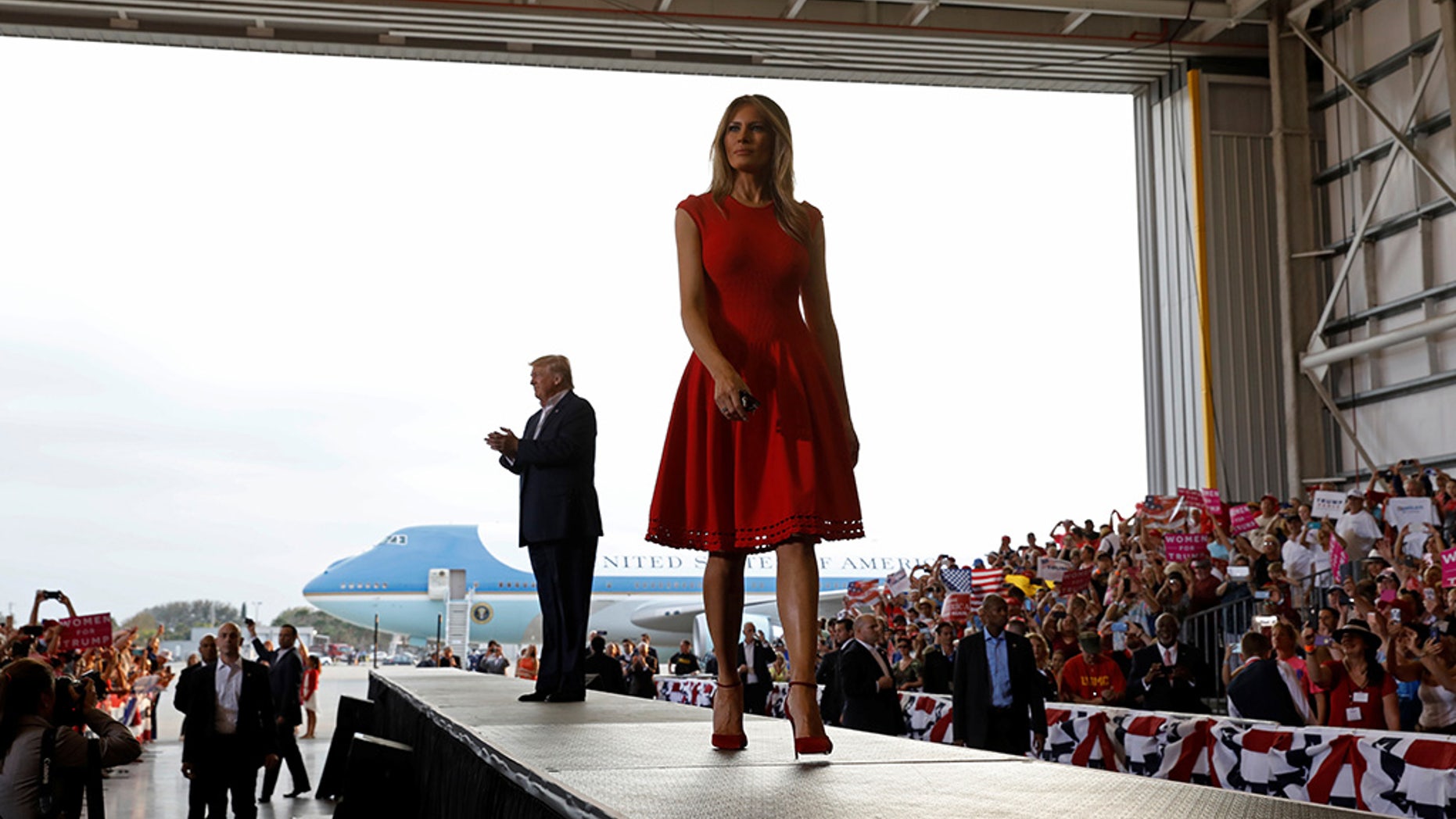 U.S. President Donald Trump and first lady Melania Trump arrive at a "Make America Great Again" rally at Orlando-Melbourne International Airport in Melbourne, Florida, U.S. February 18, 2017. REUTERS/Kevin Lamarque - RTSZBL7