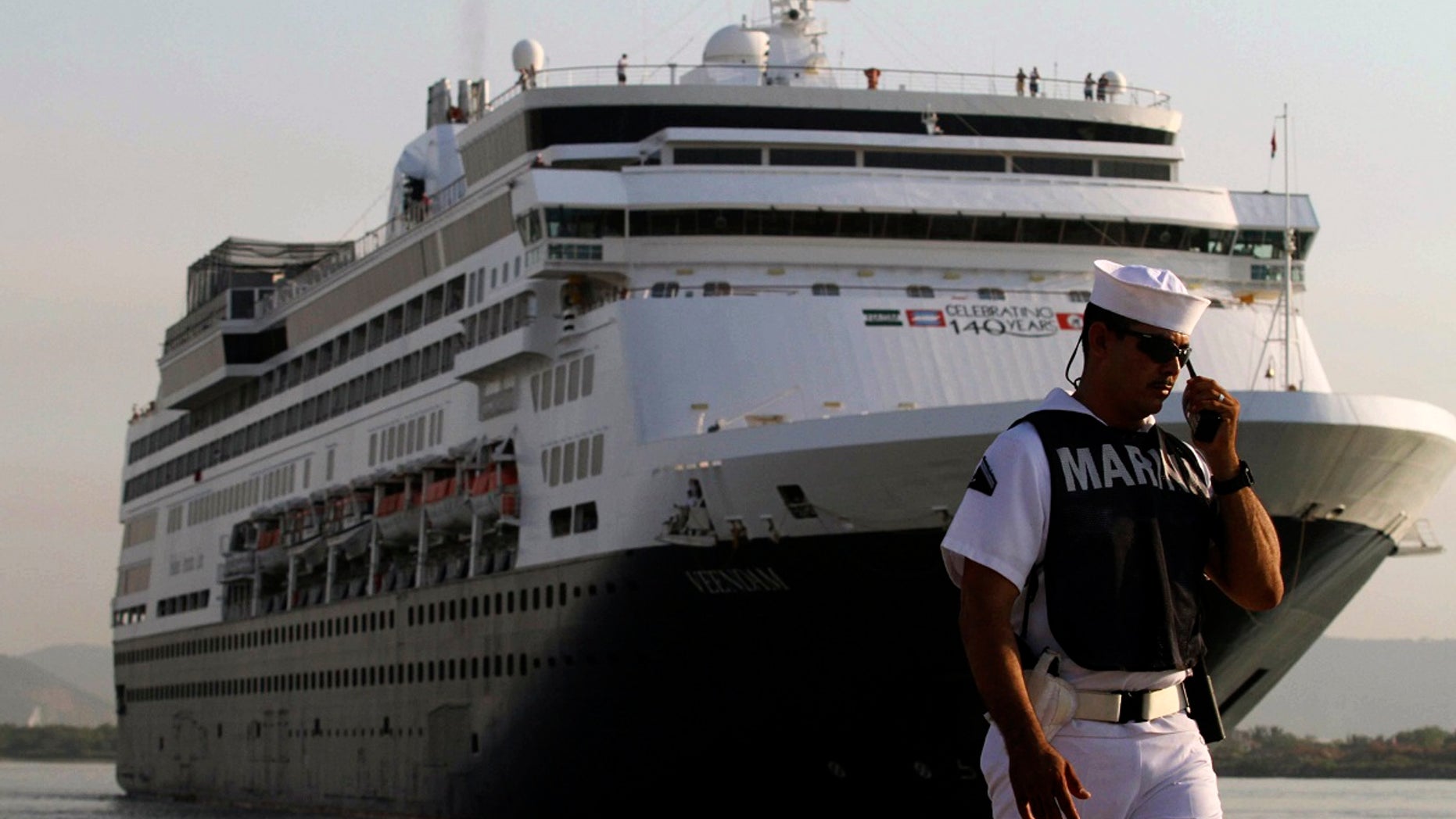 The Holland-America Line Veendam arrives at the port of Mazatlan November 12, 2013. The ship, coming from San Diego, California of the U.S. and carrying approximately 2000 passengers, is the first big cruise ship to arrive in the area since 2011. Holland-America, Carnival Cruise Lines and Disney Cruise Line among others, had stopped entering the Mazatlan port due to drug-related violence, according to local media. REUTERS/Stringer (MEXICO - Tags: SOCIETY TRAVEL MARITIME) - RTX15B4B