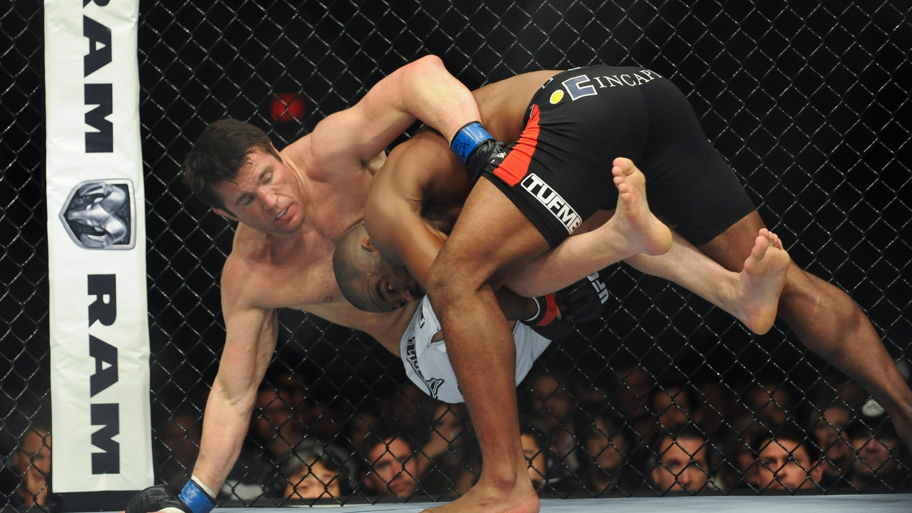 Nov 16, 2013; Las Vegas, NV, USA; Rashad Evans (red gloves) fights against Chael Sonnen (blue gloves) in their light heavyweight bout during UFC 167 at MGM Grand Garden Arena. Mandatory Credit: Stephen R. Sylvanie-USA TODAY Sports - RTX15GPU