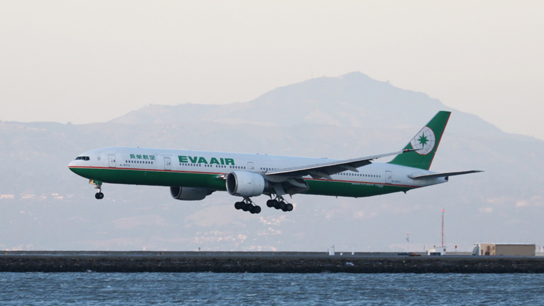 An Eva Air Boeing 777-300ER, with Tail Number B-16711, lands at San Francisco International Airport, San Francisco, California, April 11, 2015. REUTERS/Louis Nastro - RTX19W22
