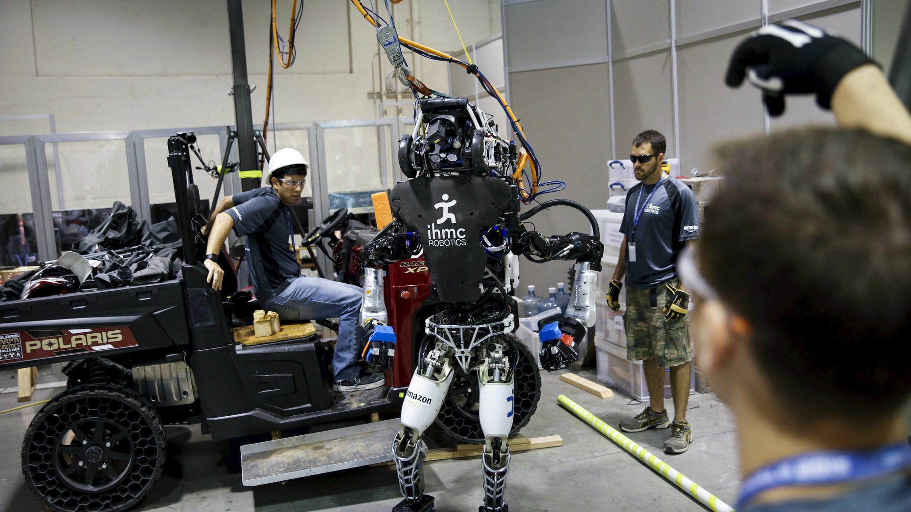 File photo: The Team IHMC Robotics Atlas "Running Man" robot built by Boston Dynamics is readied in the team garage during the finals of the Defense Advanced Research Projects Agency (DARPA) Robotic Challenge in Pomona, California June 6, 2015. (REUTERS/Patrick T. Fallon)