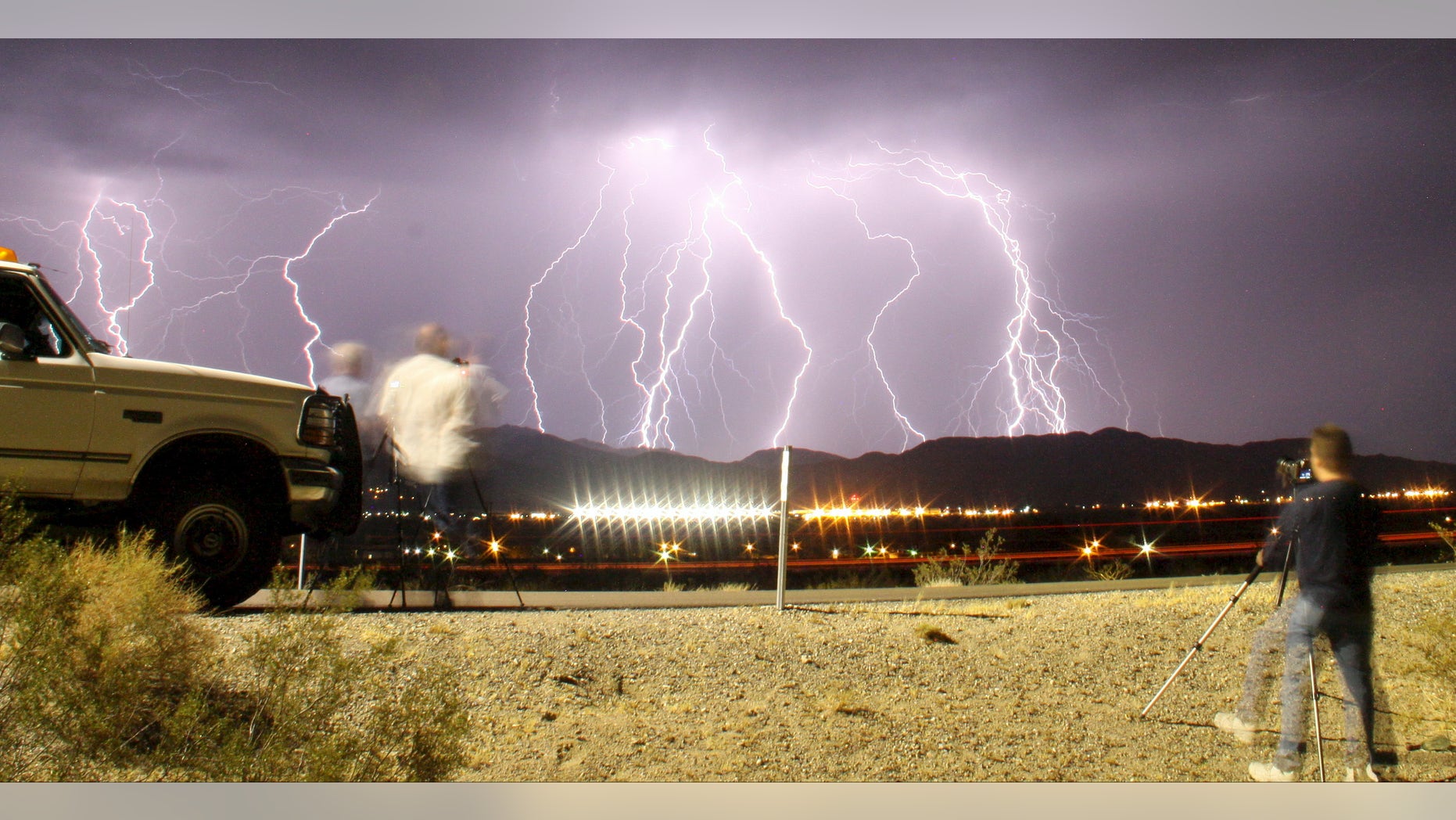 File photo: Southern California storm chasing photographers take pictures of the mass lightning bolts lighting up night skies from monsoon storms passing over the high deserts, early Wednesday north of Barstow, California, July 1, 2015. Picture taken using long exposure. (REUTERS/Gene Blevins)