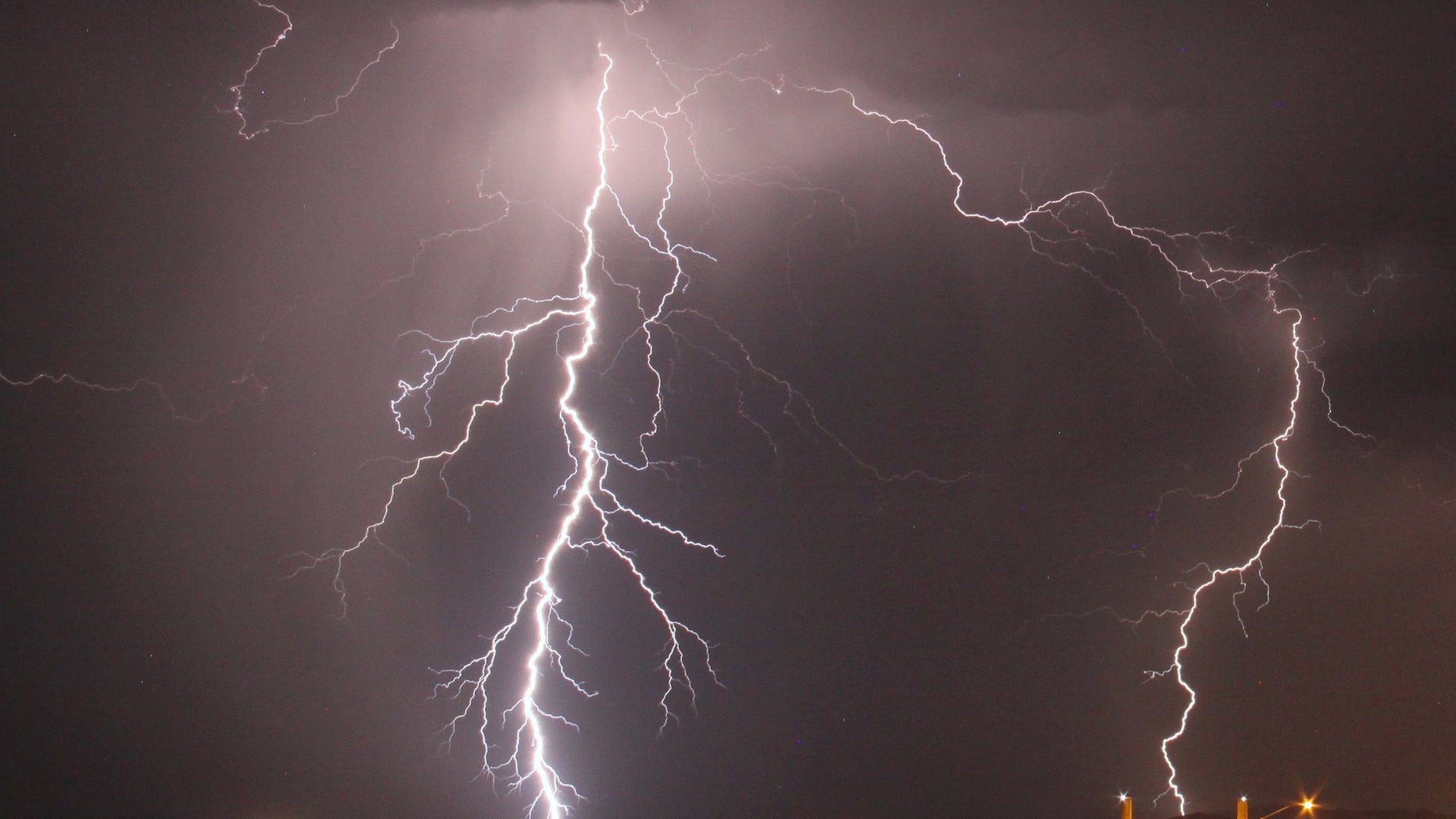 Mass lightning bolts light up night skies by Daggett airport from monsoon storms passing over the high deserts early Wednesday, north of Barstow, California, July 1, 2015. Picture taken using long exposure. REUTERS/Gene Blevins - RTX1ILCN