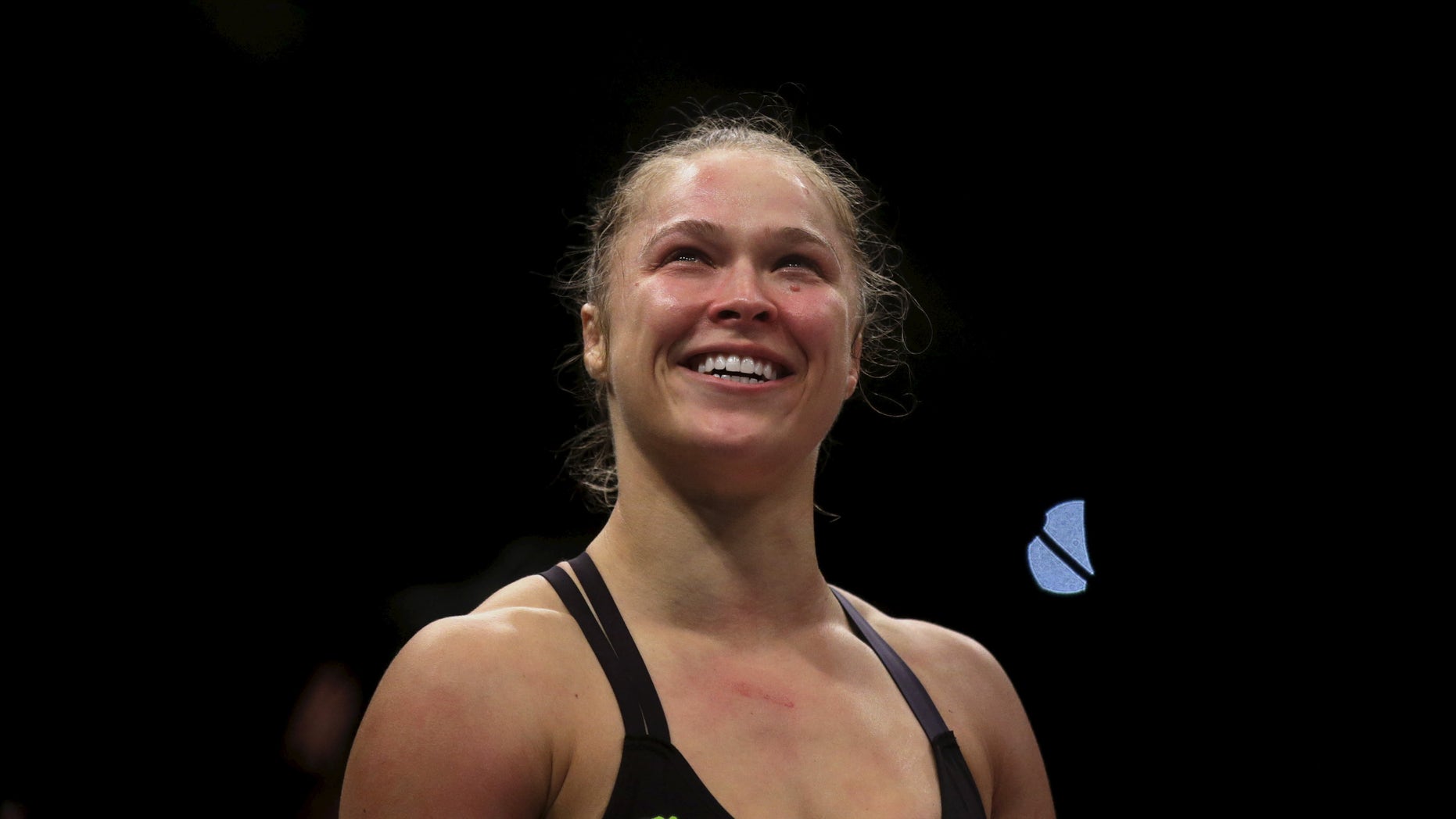 Ronda Rousey (R) of U.S celebrates after defeating Bethe Correia of Brazil during their Ultimate Fighting Championship (UFC) match, a professional mixed martial arts (MMA) competition in Rio de Janeiro, Brazil August 1, 2015.