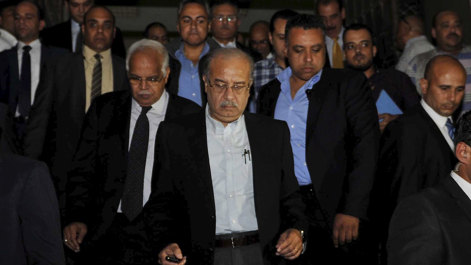Egypt's Prime Minister Sherif Ismail, center, denounced the attack, officials said.