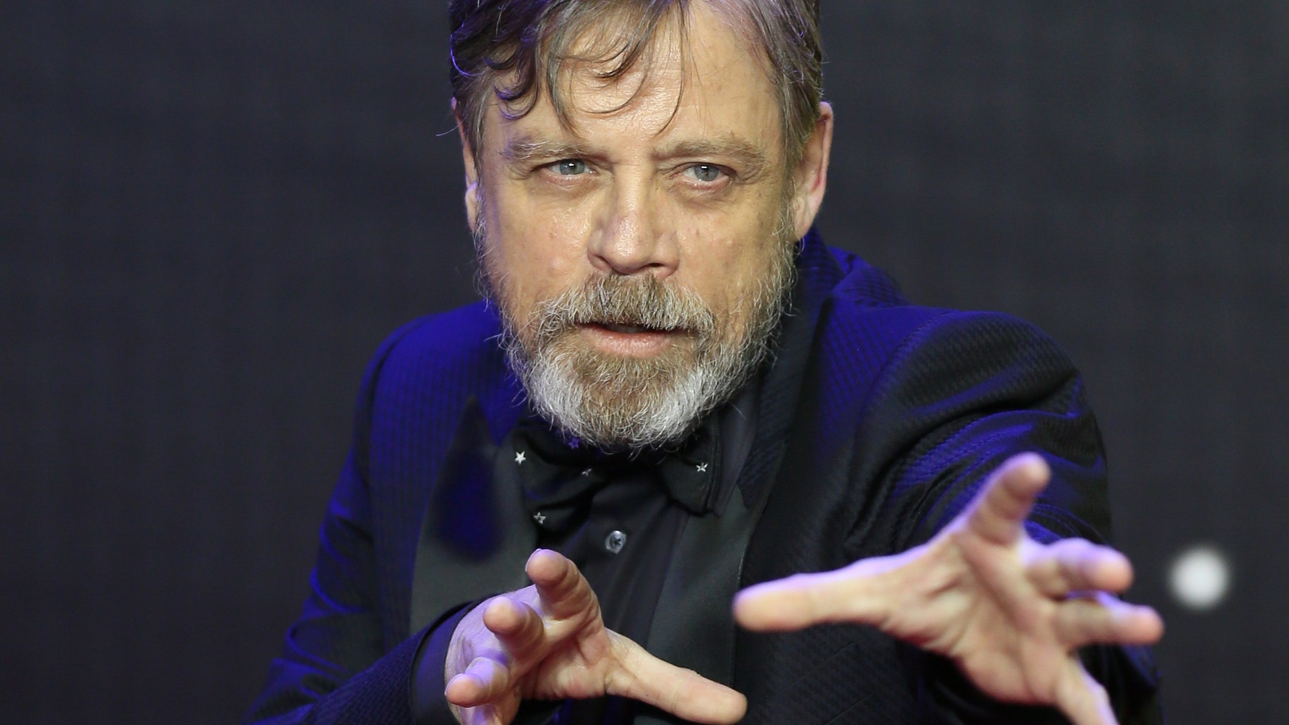Mark Hamill gestures as he arrives at the European Premiere of Star Wars, The Force Awakens in Leicester Square, London, December 16, 2015.
