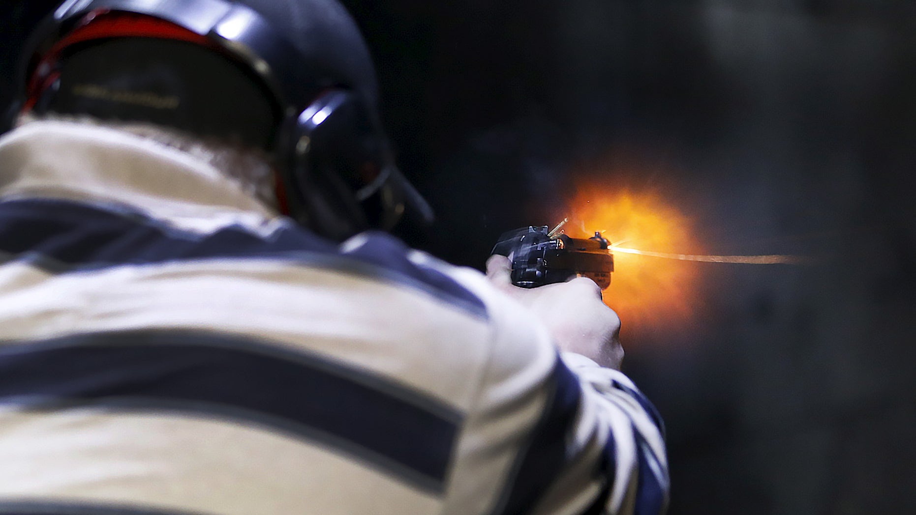 File photo: A man fires a Sig P320 handgun at the Ringmasters of Utah gun range, in Springville, Utah on December 18, 2015. (REUTERS/George Frey)