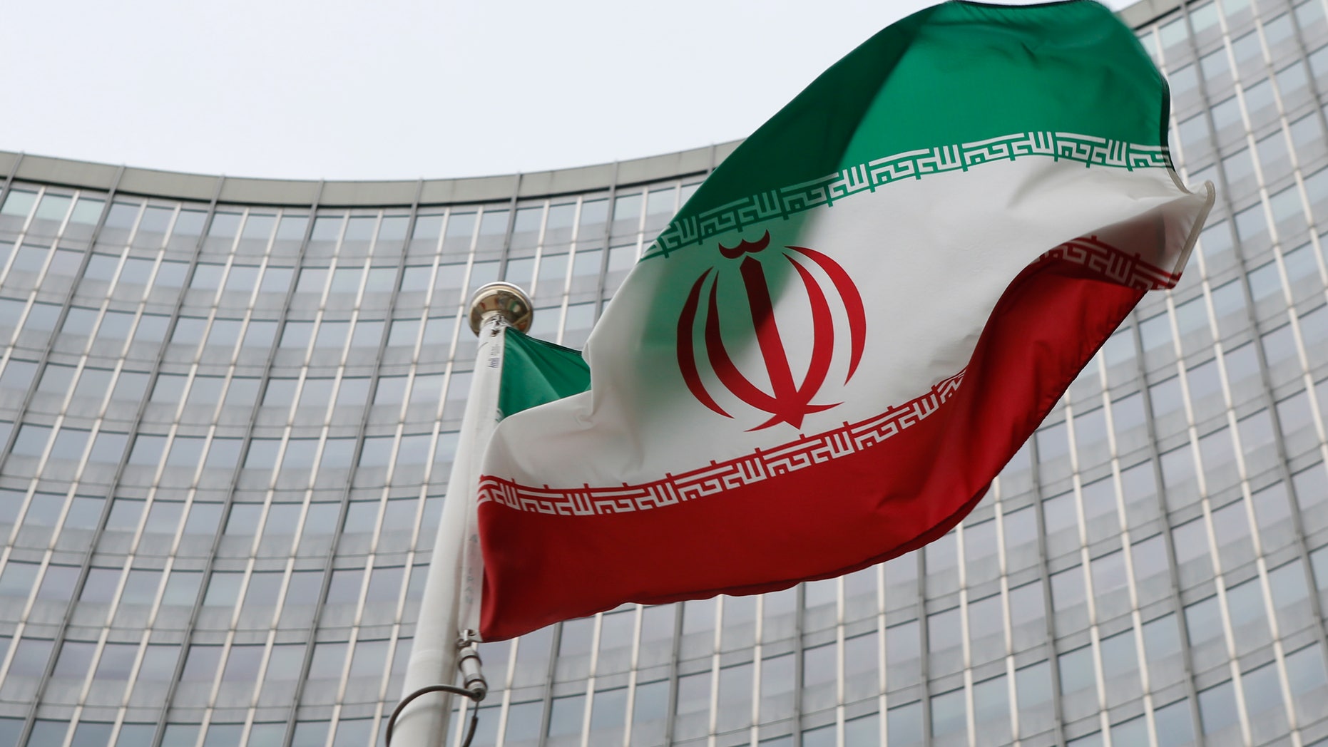 Jan. 15, 2016: An Iranian flag flutters in front of the International Atomic Energy Agency headquarters in Vienna, Austria. (REUTERS)