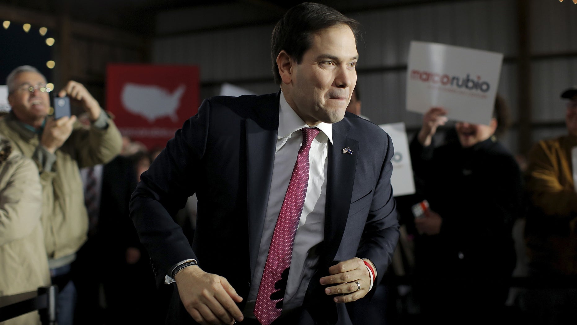 U.S. Republican presidential candidate Marco Rubio runs toward the stage as he is introduced during a campaign town hall at Harmon's Tree Farm in Gilbert, South Carolina February 15, 2016. REUTERS/Chris Keane - RTX2734O