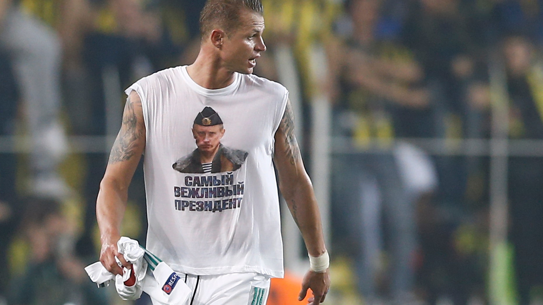 Feb. 16, 2016: Lokomotiv Moscow's Dmitri Tarasov wearing a t-shirt depicting Russian President Vladimir Putin. (Reuters)