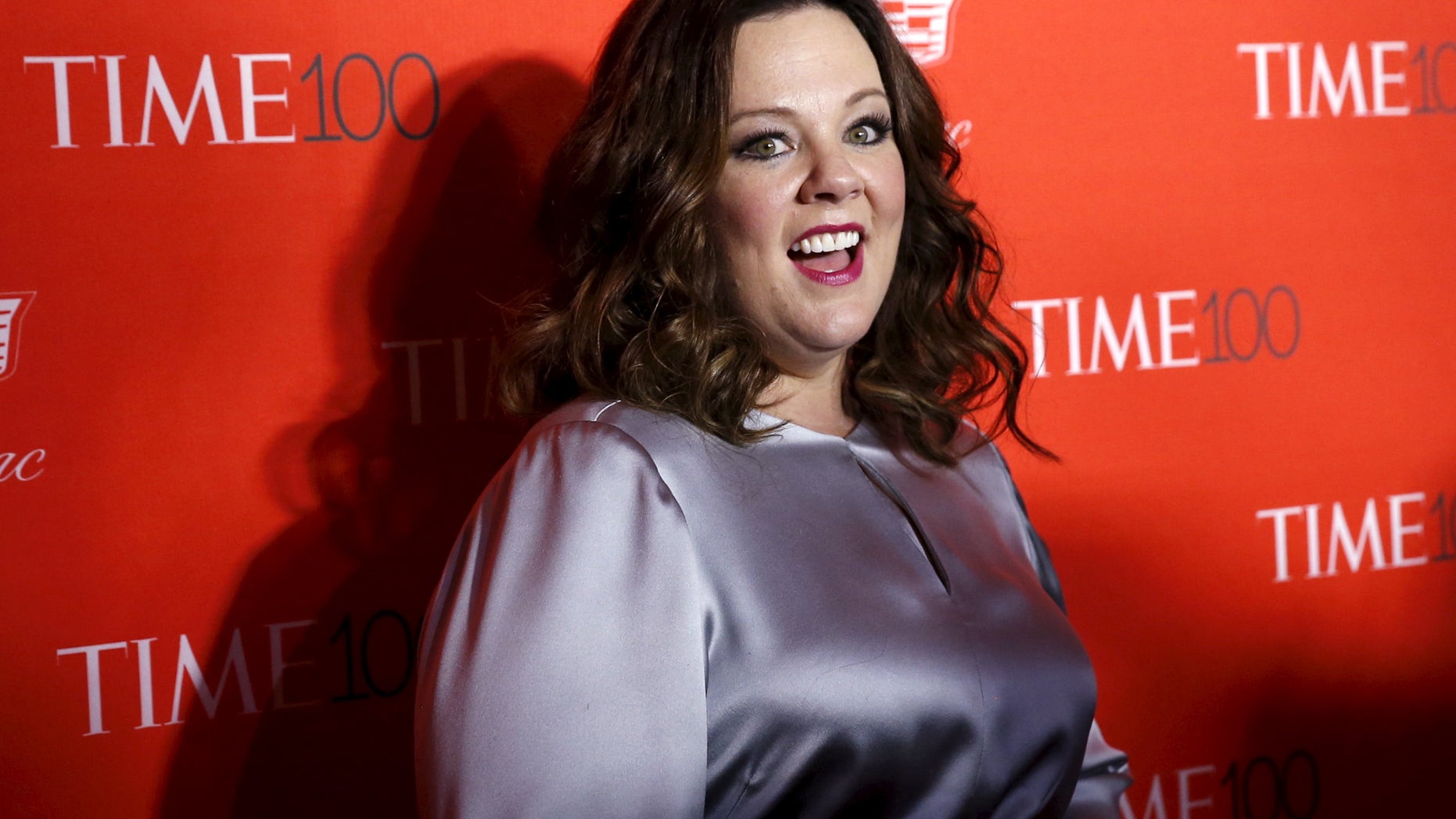 Actress Melissa McCarthy poses for photographers on the red carpet as she arrives for the TIME 100 Gala in Manhattan, New York, April 26, 2016. REUTERS/Shannon Stapleton - RTX2BSYF