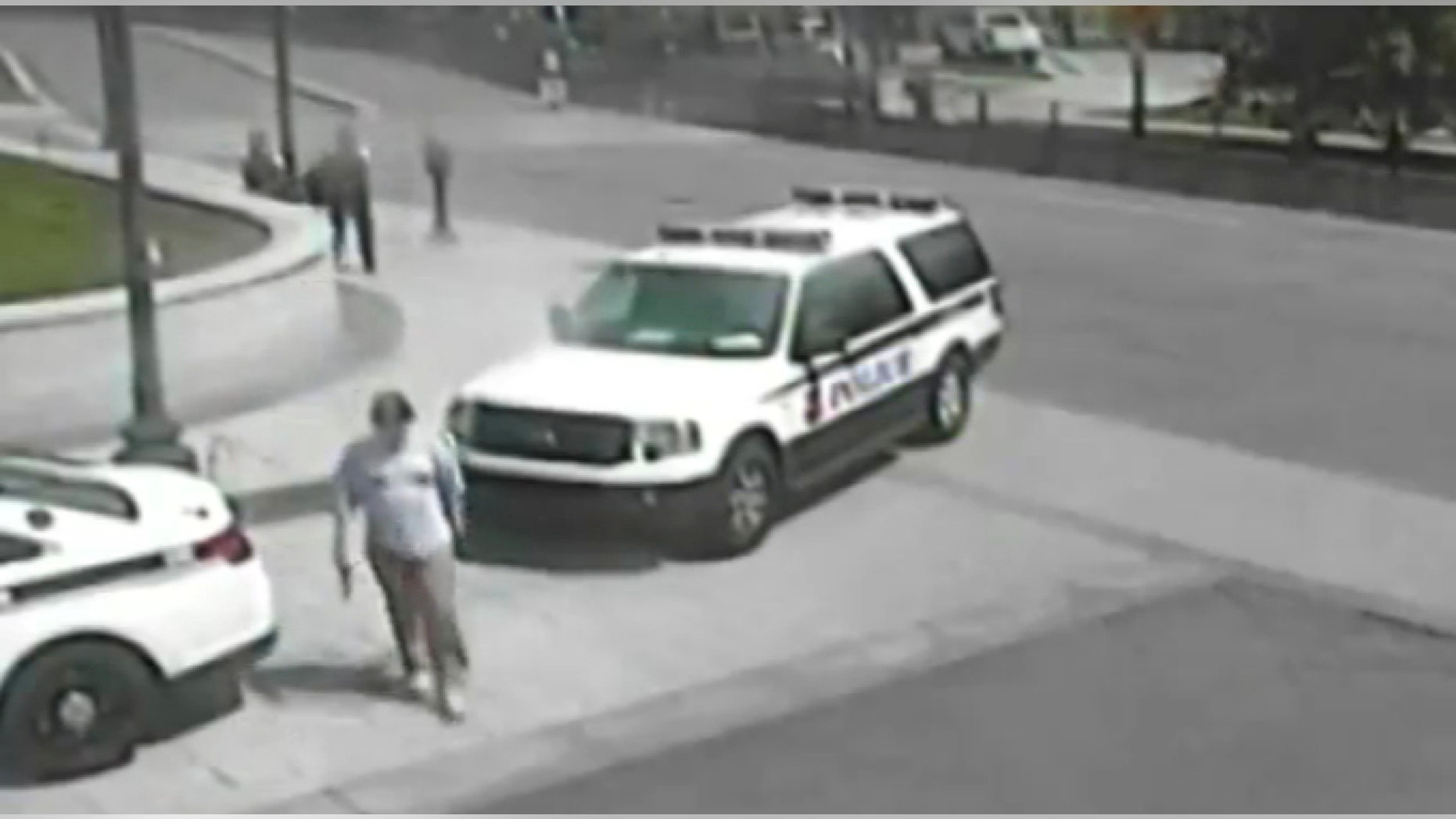 Jesse Olivieri seen in security video carrying a gun before being shot.