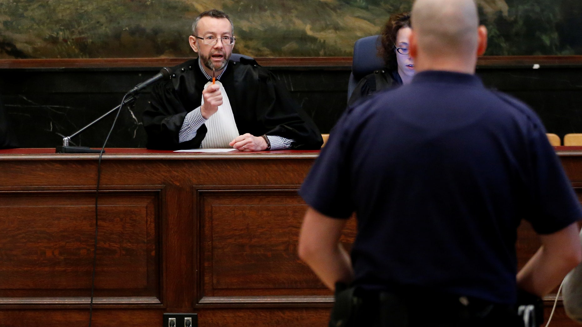 Belgian judge Pierre Hendrickx presides over the trial of suspects in the foiled Islamist attack plot in the town of Verviers.