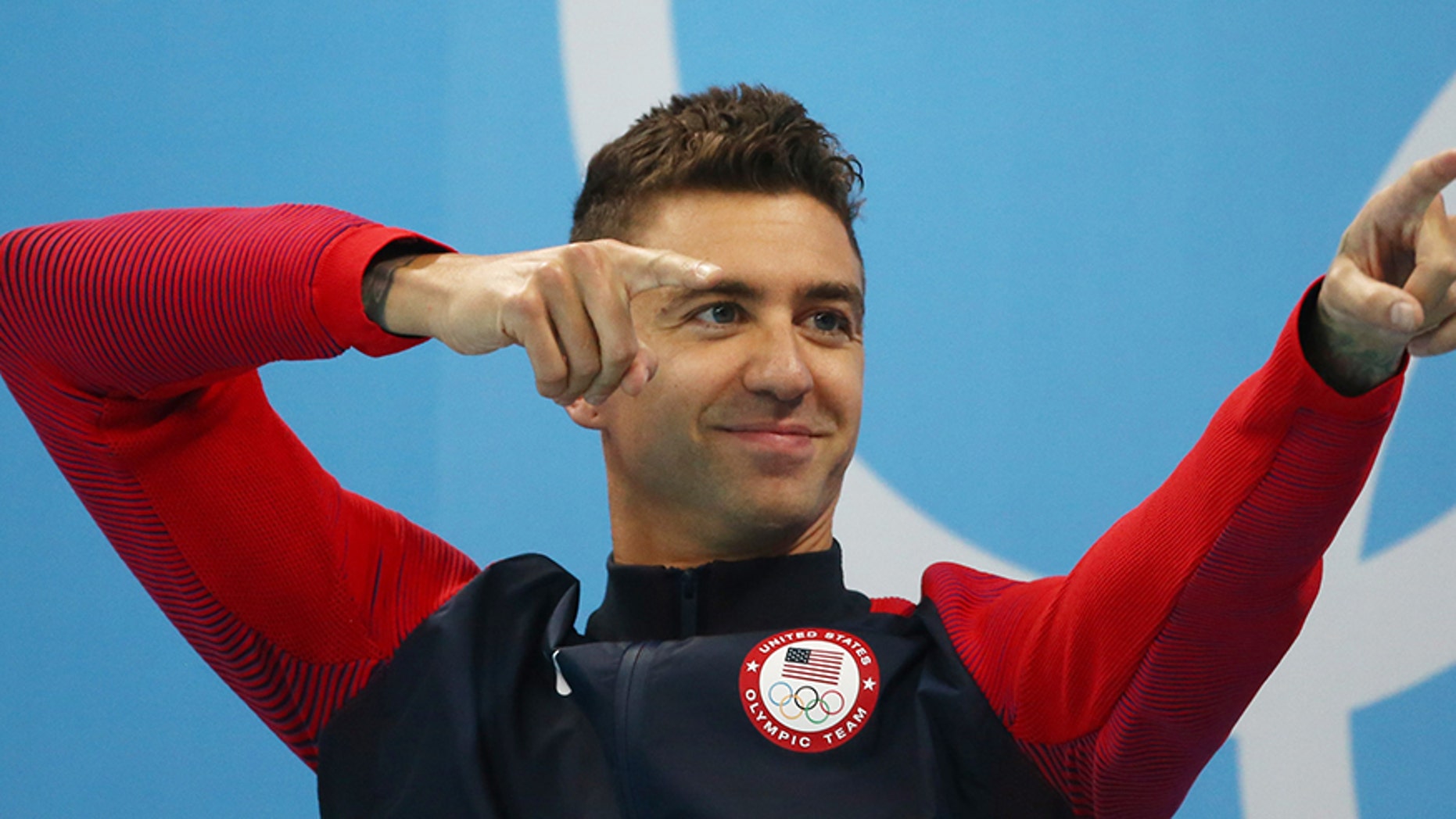 U.S. Olympic gold medal swimmer Anthony Ervin took a knee during the national anthem after he anchored Team USA's mixed 200-meter medley race in Brazil.