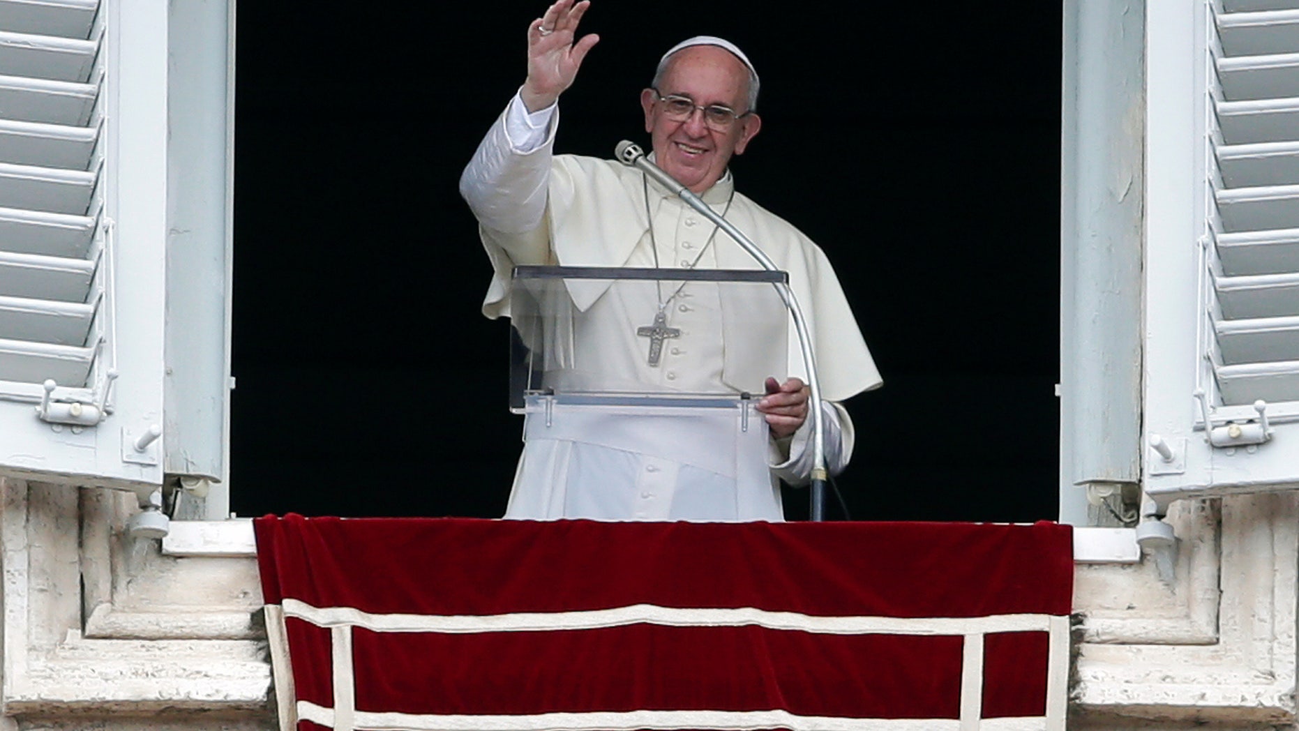 Pope Francis waves at Saint Peter's Square on Sunday.