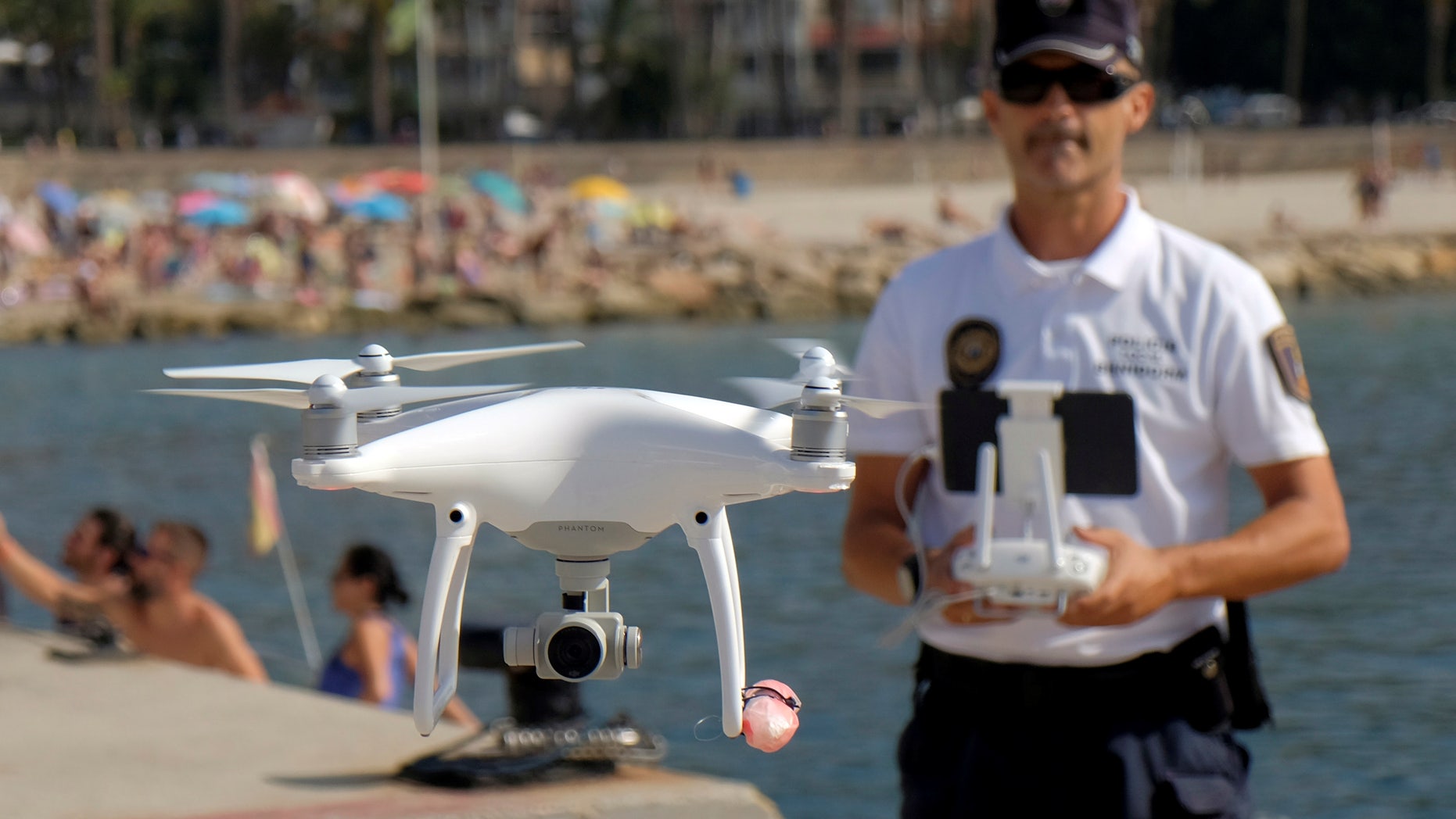 File photo: Local police officer Agustin Mirete controls a drone equipped with a camera used for surveillance tasks in the Poniente beach at the eastern costal town of Benidorm, Spain, August 18, 2016. (REUTERS/Heino Kalis)