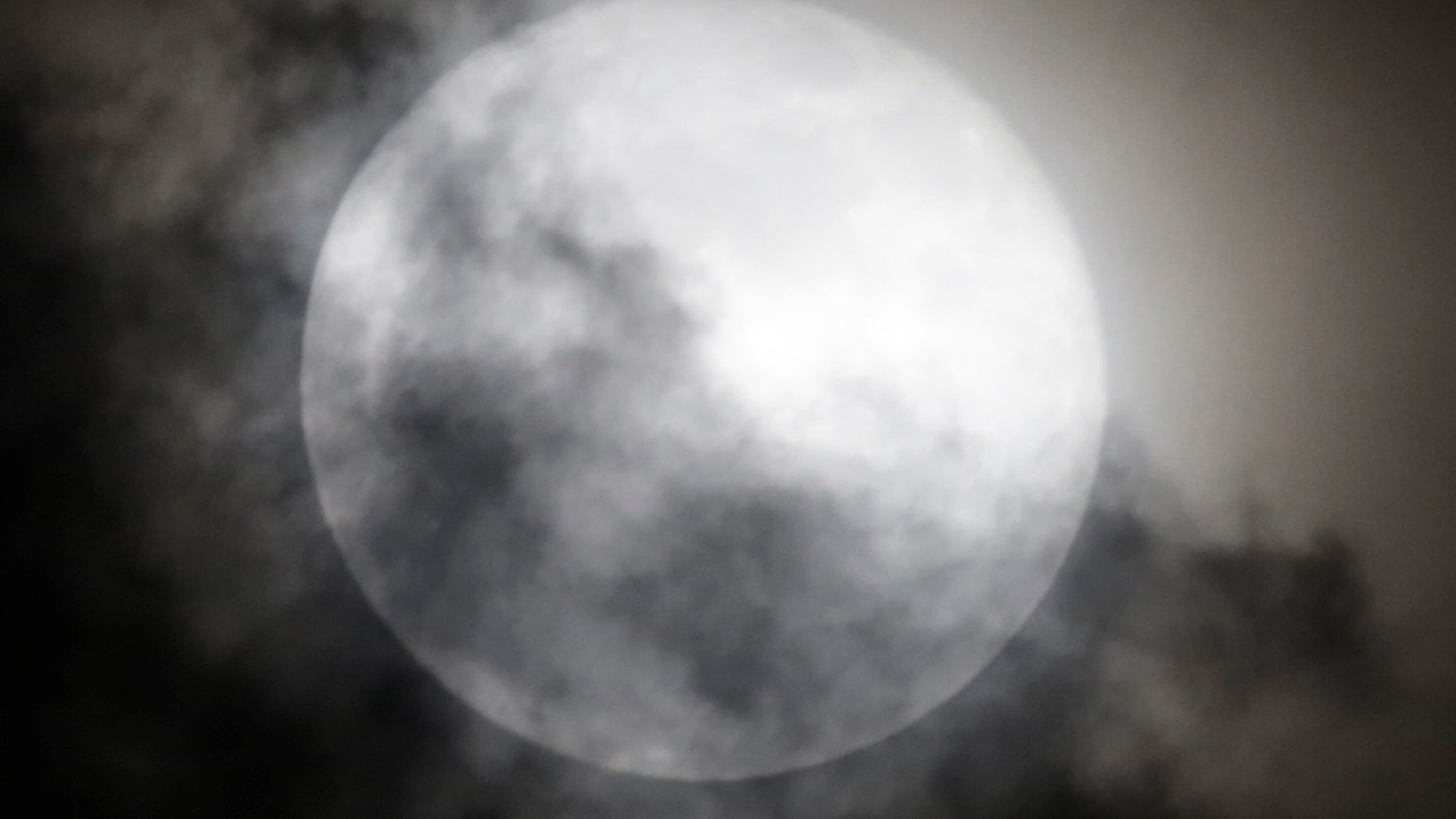 A supermoon rises over Mexico City, Mexico, October 16, 2016. (REUTERS/Henry Romero)