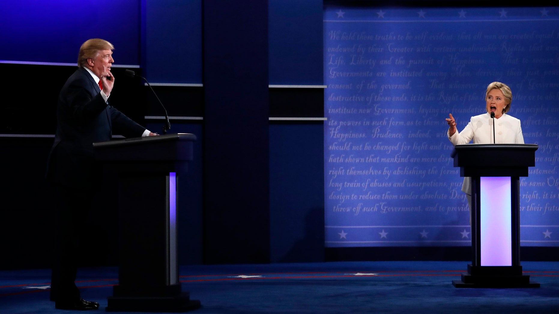 Republican U.S. presidential nominee Donald Trump and Democratic nominee Hillary Clinton speak at the same time as they discuss an issue during their third and final 2016 presidential campaign debate at UNLV in Las Vegas, Nevada, U.S., October 19, 2016. REUTERS/Carlos Barria TPX IMAGES OF THE DAY - RTX2PLZM