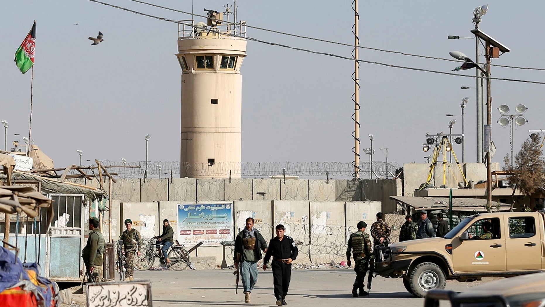 Five U.S. troops were wounded when a suicide bomber drove a car bomb into an armored convoy outside Bagram Air Base.
