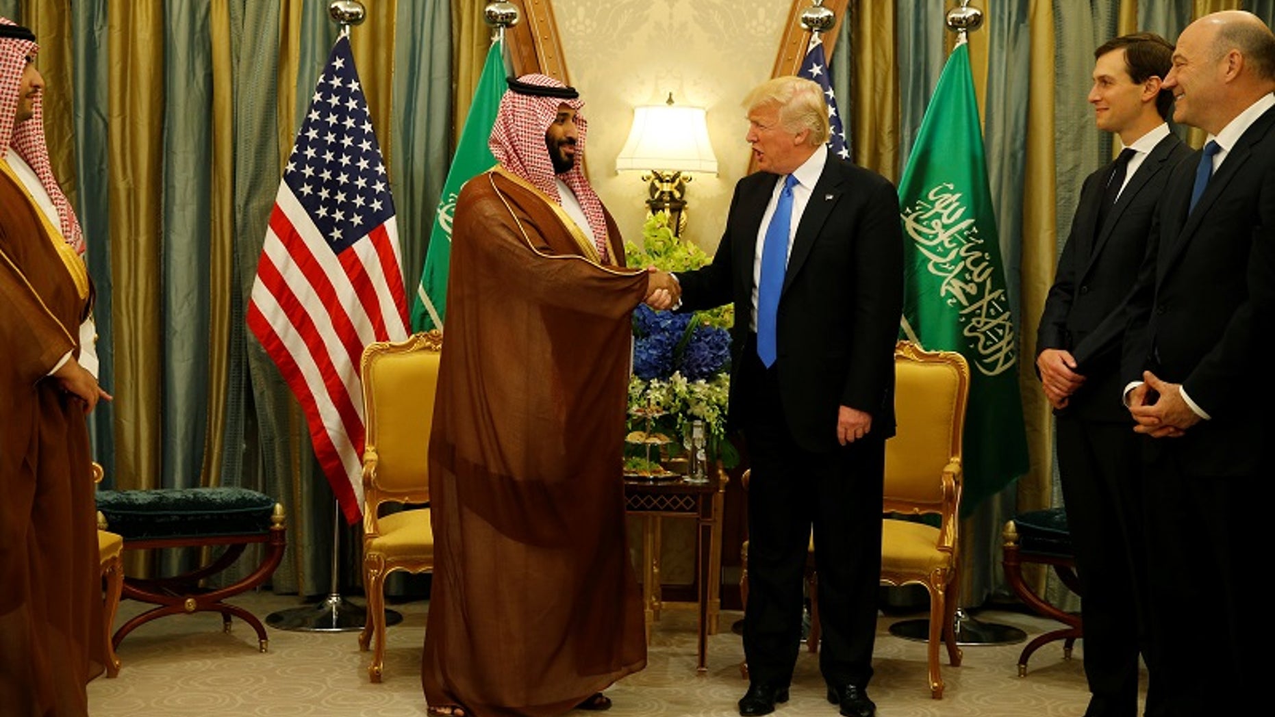FILE -- President Donald Trump meets with Saudi Arabia's Deputy Crown Prince and Minister of Defense Mohammed bin Salman (center L) at the Ritz Carlton Hotel in Riyadh, Saudi Arabia May 20, 2017.