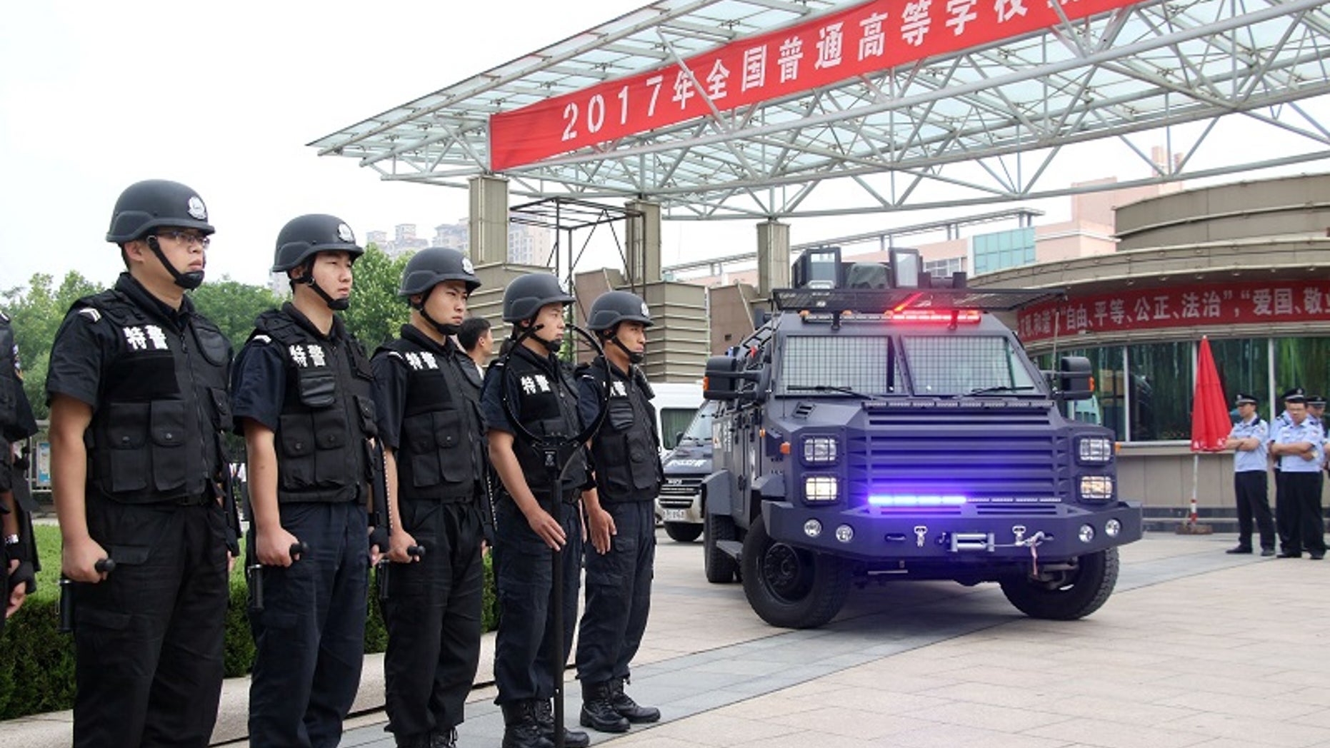 Special force police officers stand guard outside a high school, on the first day of China's national college entrance exam known as "gaokao", in Binzhou, Shandong province, China June 7, 2017.