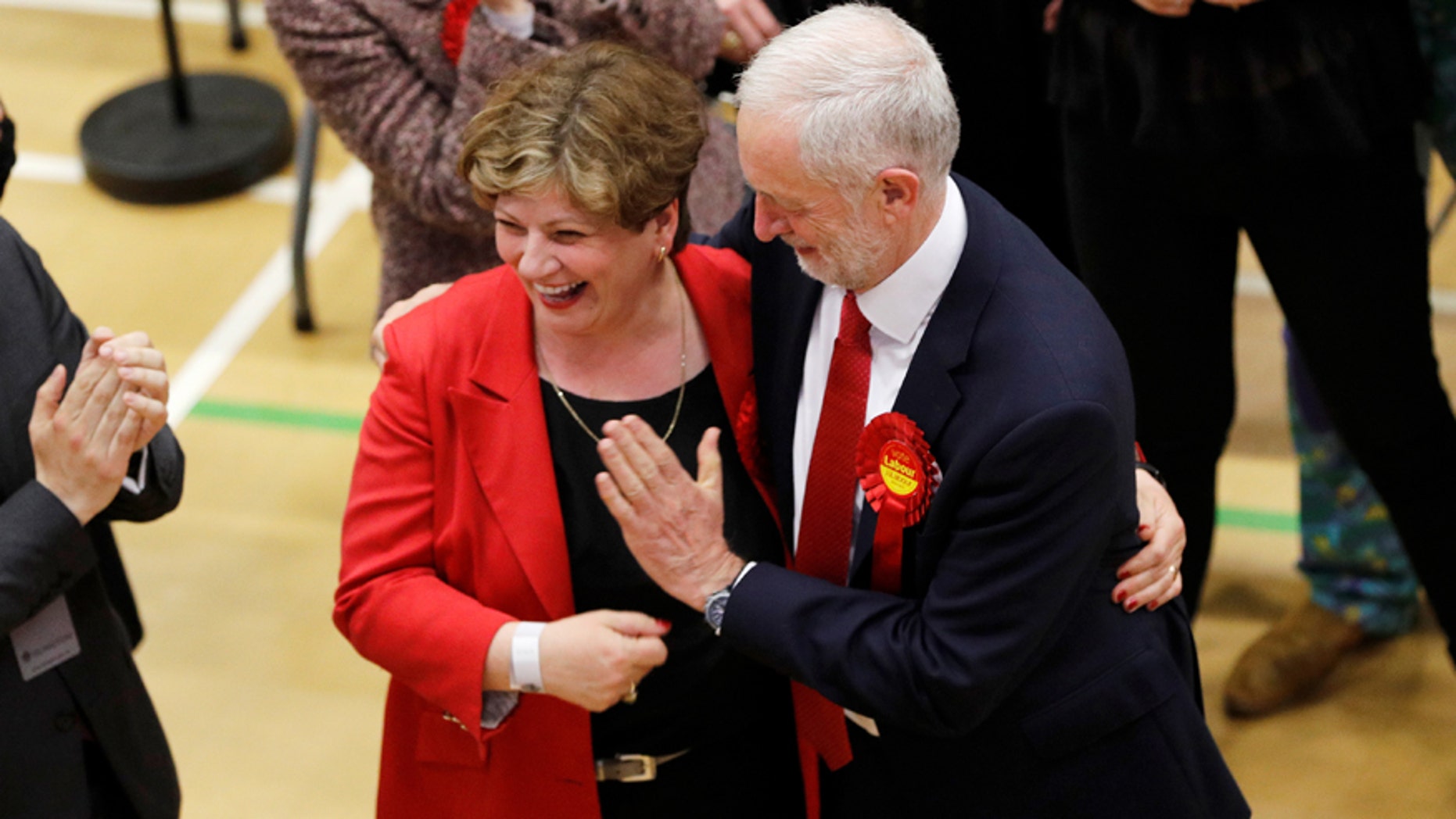 Jeremy Corbyn, leader of Britain's Labour Party tries to exchange a high five with Shadow Foreign Secretary Emily Thornberry at Britain's general election counting centre in Islington, London, June 9, 2017. REUTERS/Darren Staples - RTX39RN5