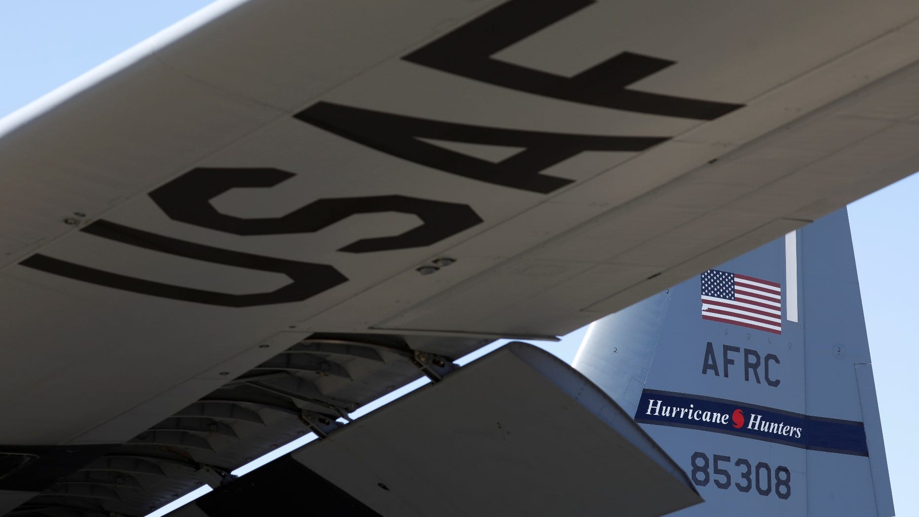 FILE -- A tail of the WC-130J Super Hercules from the Air Force's 53rd Weather Reconnaissance Squadron bears the name "Hurricane Hunters" as the plane awaits its departure from Keesler Air Force Base in Biloxi, Mississippi.