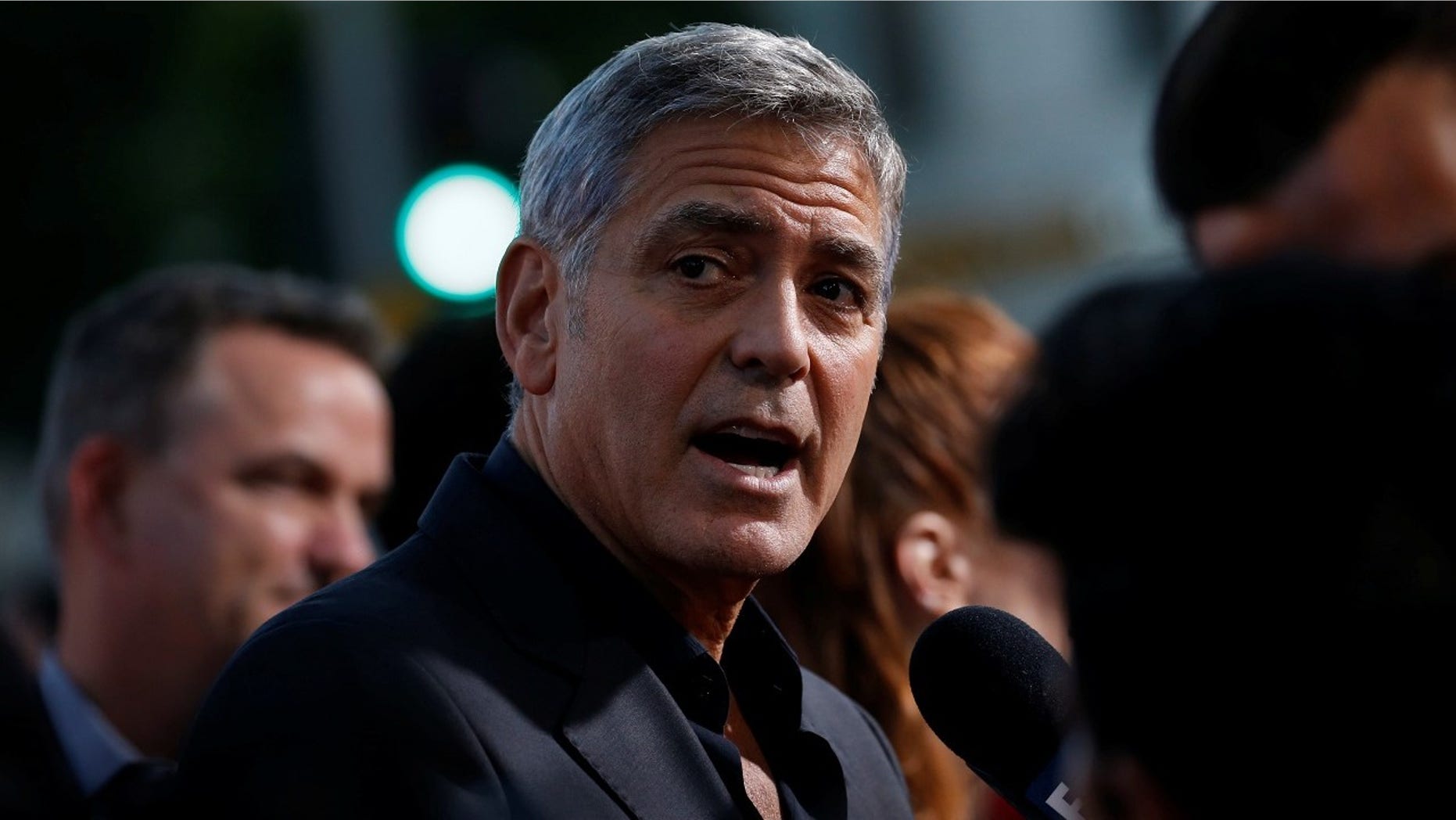George Clooney said he hopes the sexual harassment stories after the Harvey Weinstein scandal will be a "watershed moment for society."