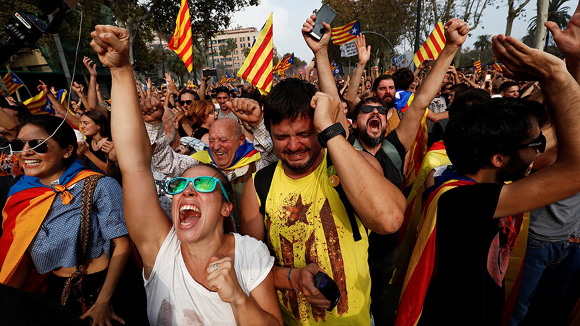 Pro-independence Catalan celebrate outside the Parliament after lawmakers voted to declare the region's independence from Spain.