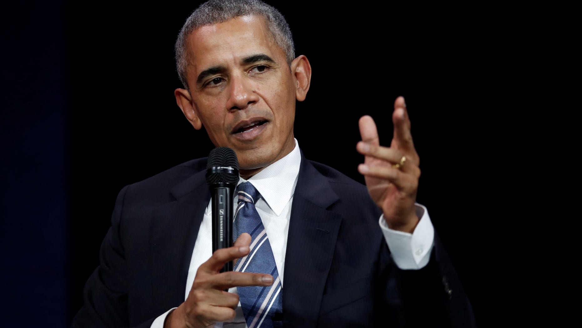 FILE - Former President Barack Obama speaks at a conference during his first visit to France since he left the White House.