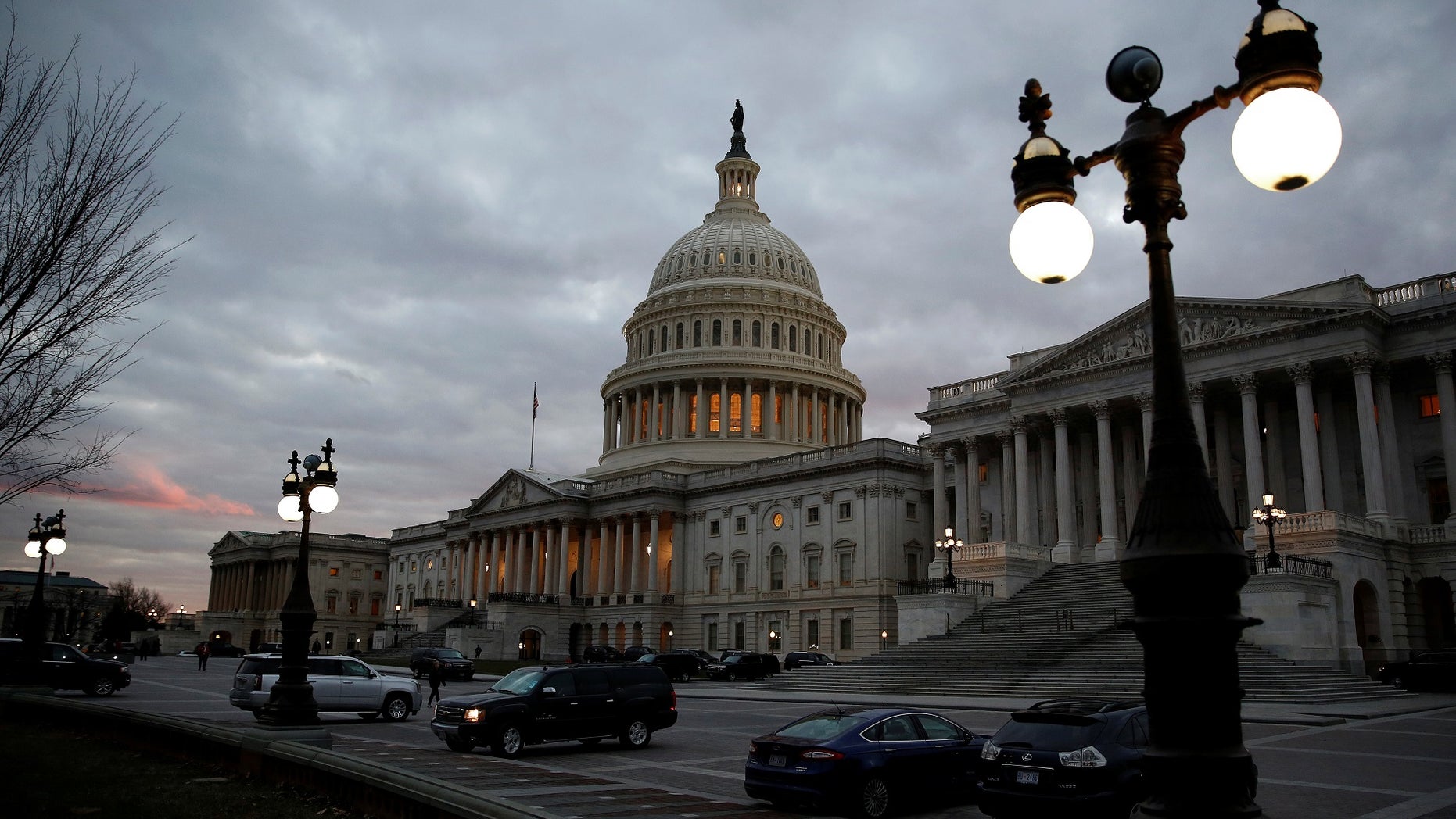 The U.S. Capitol building is lit at dusk in Washington, U.S., December 18, 2017.
