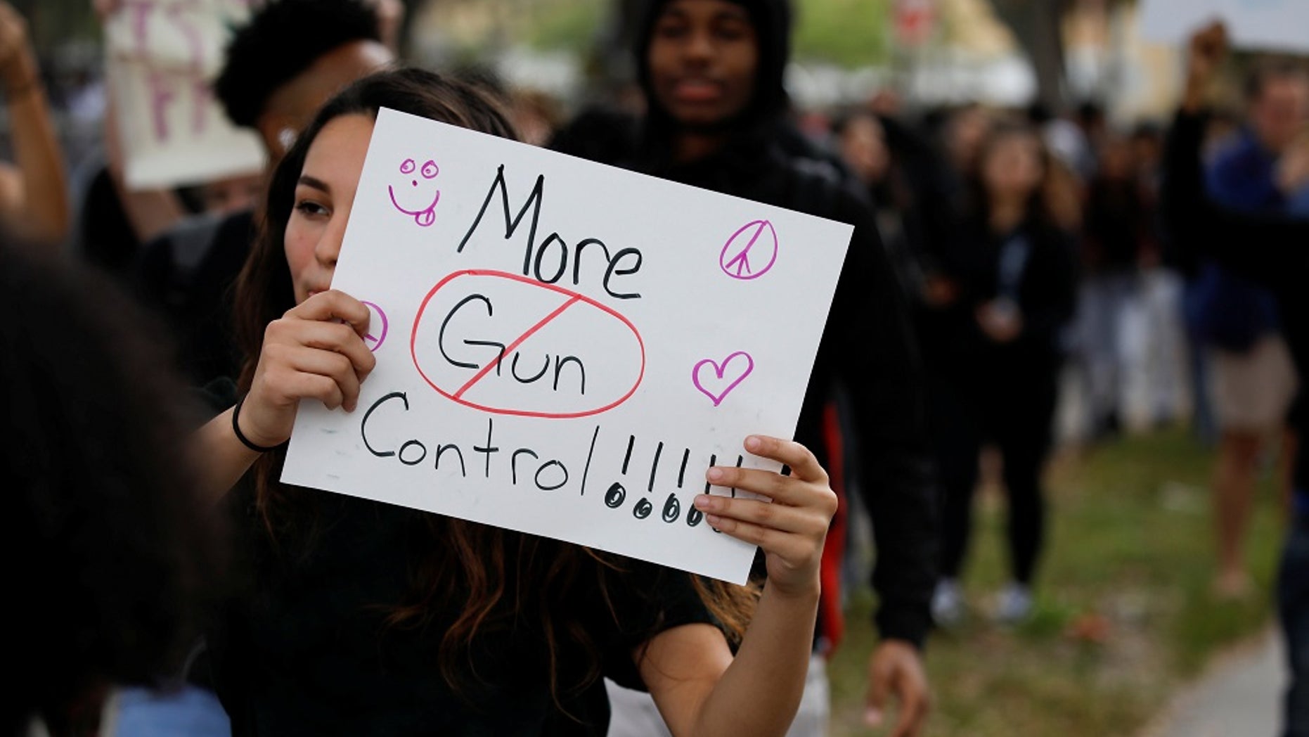 In this February 2018 photo, students from Plantation High School protest in support of gun control following at mass shooting at Marjory Stoneman Douglas High School. On Wednesday, students and parents from Broward County School district met for a forum on school safety.