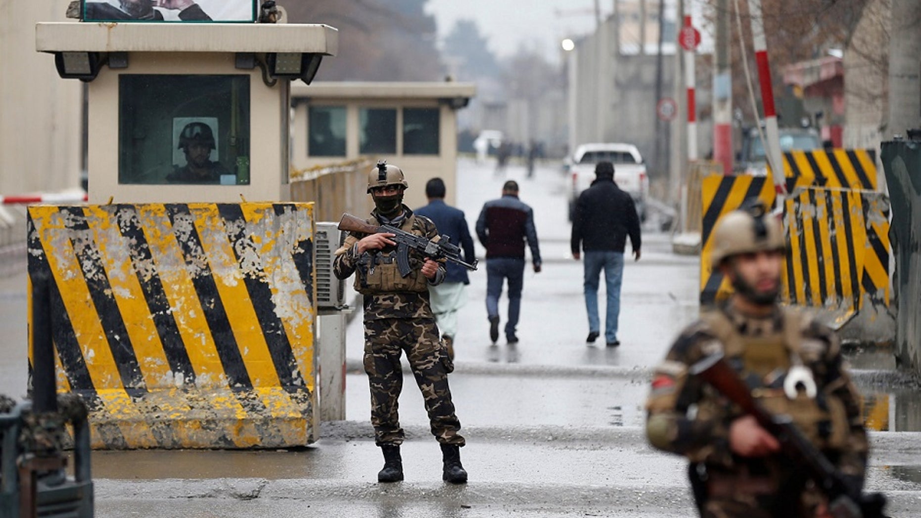 Security forces guard the site of a suicide bombing in the diplomatic area of Kabul, Afghanistan, Saturday Feb. 24, 2018, near the US Embassy and NATO HQ.