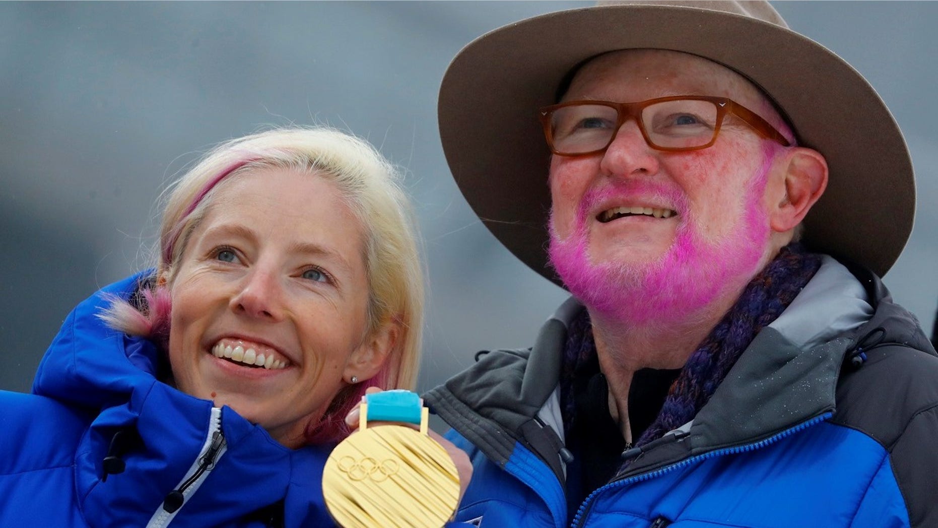 Tom Kelly, Vice President, Communication at the U.S. Ski and Snowboard Association, painted his beard pink after Kikklan Randall won gold.