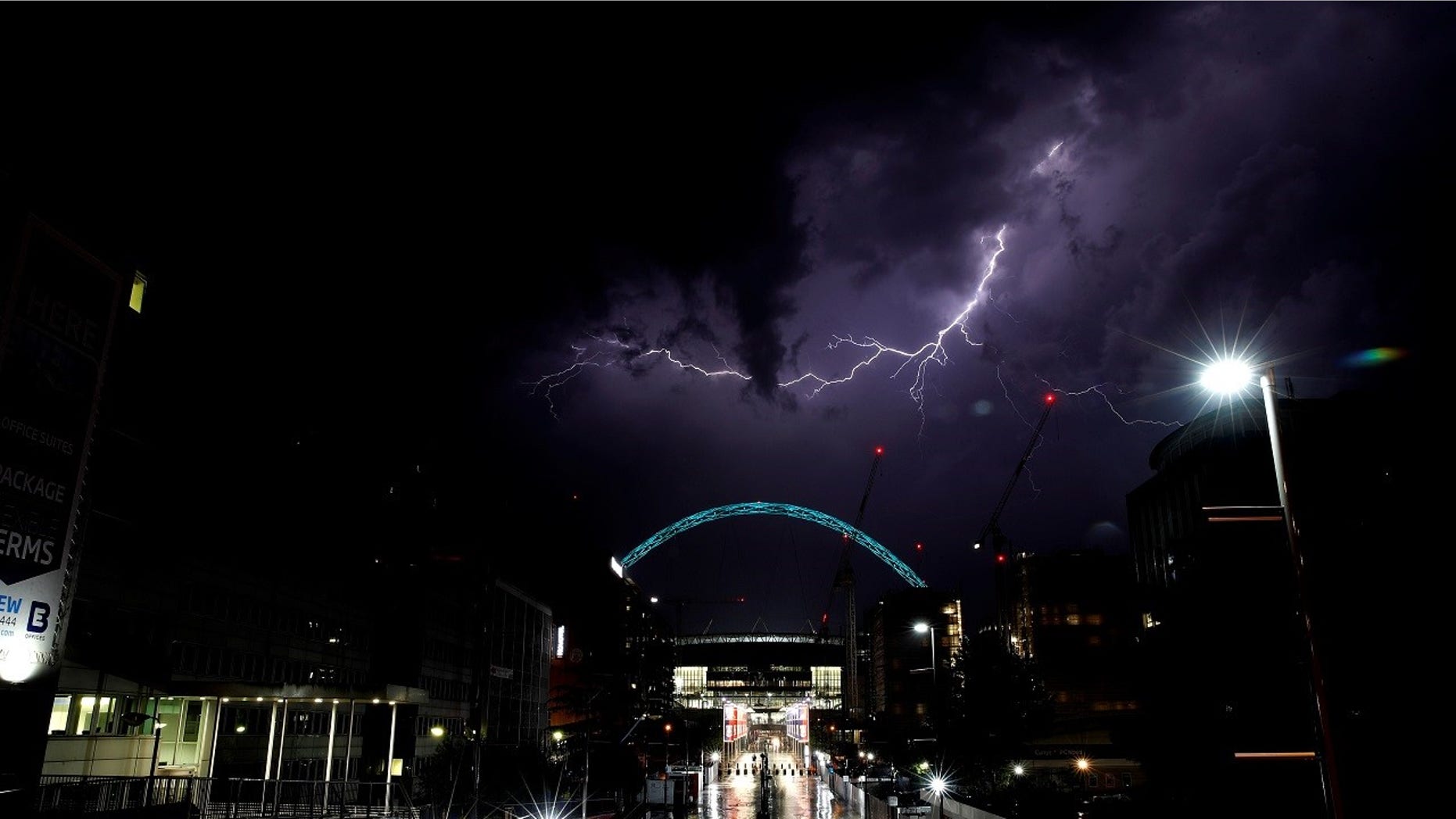Lightning strikes above Wembley Stadium in London.