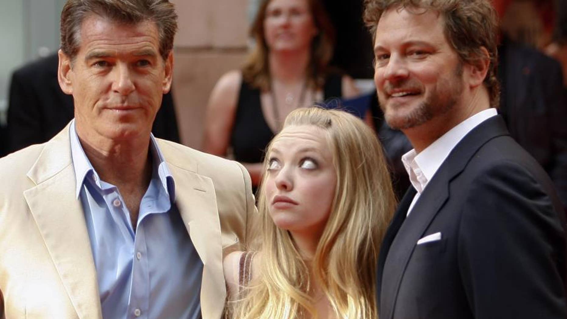 Even actress Amanda Seyfried can't get her eyes off Pierce Brosnan while promoting their film in Stockholm on July 4, 2008.