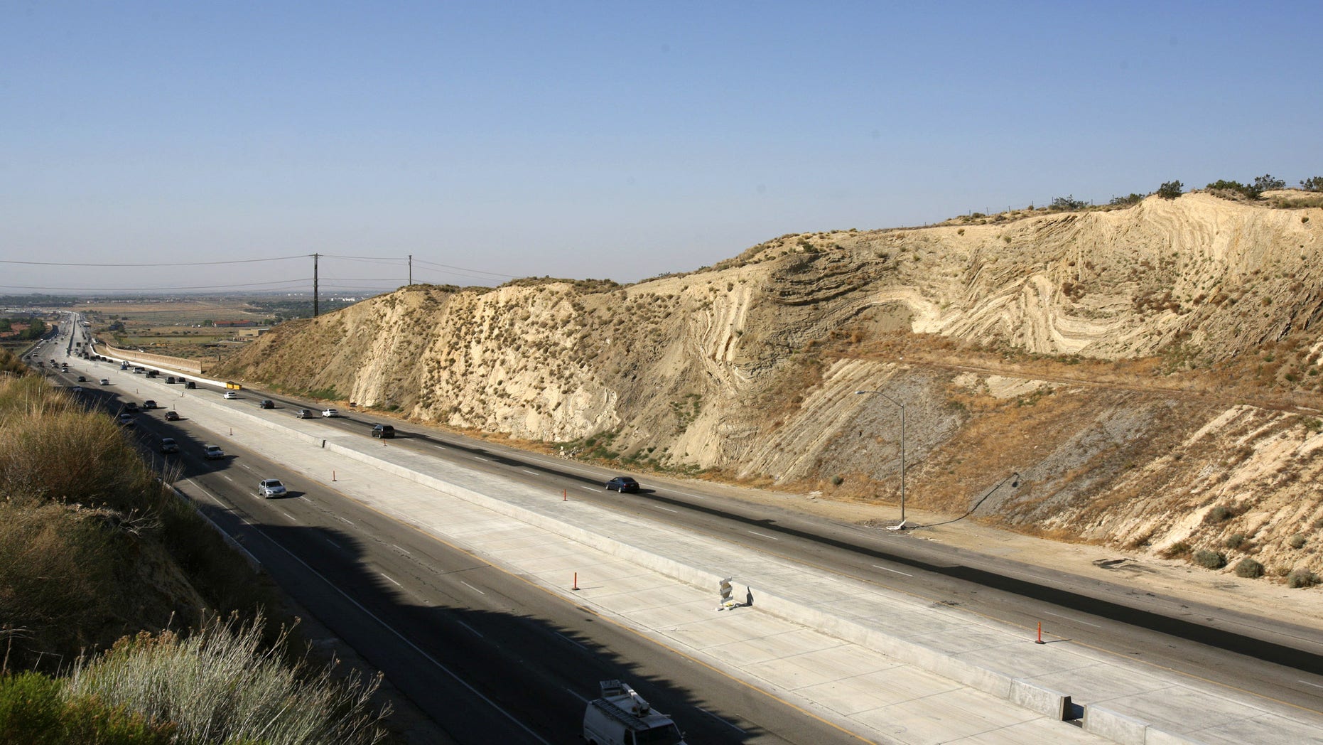 California's Antelope Valley freeway passes near folded layers of sediment above the San Andreas Fault near Palmdale, California June 22, 2006.