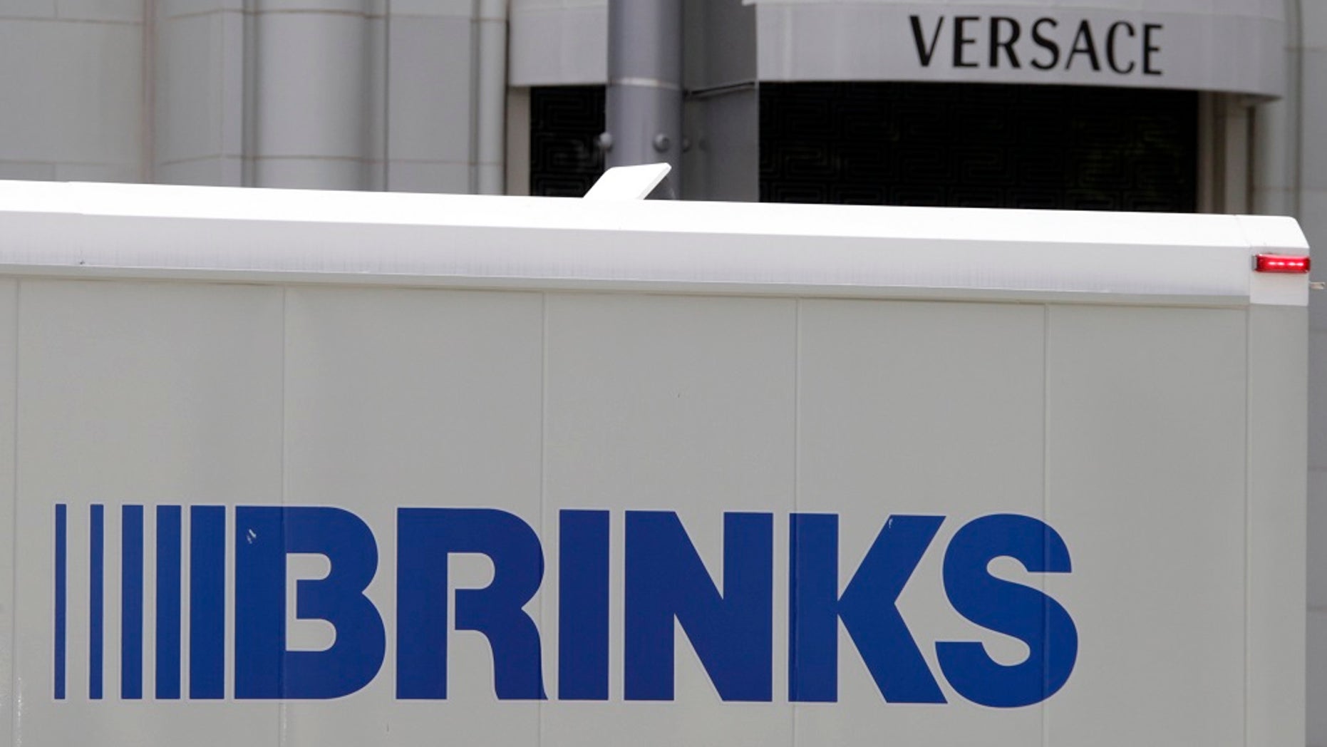 Indiana State Police say people clamored to pick up cash on Interstate 70 after a Brinks armored truck opened and cash flew out the back.