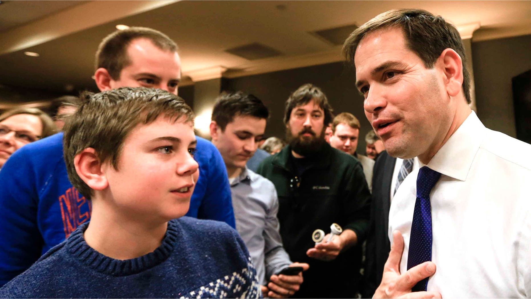 Rubio talks to members of the audience following a campaign stop in Iowa, Sat. Jan. 16, 2016.