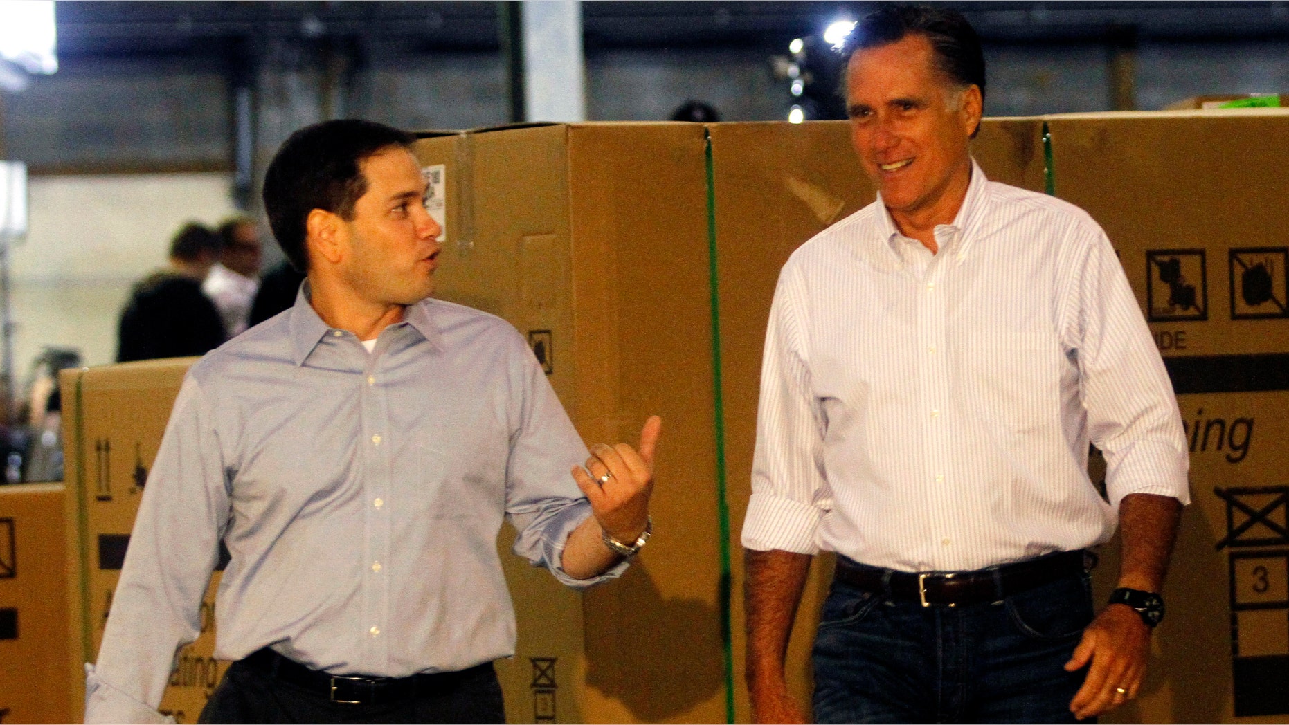ASTON, PA - APRIL 23: Republican presidential candidate and former Massachusetts Gov. Mitt Romney (R) arrives before a town hall during a campaign stop with Florida Sen. Marco Rubio (L) at Mustang Expediting April 23, 2012 in Aston, Pennsylvania. Romney continues his campaign as the presumptive GOP candidate the day before the Pennsylvania primary. (Photo by Jessica Kourkounis/Getty Images)