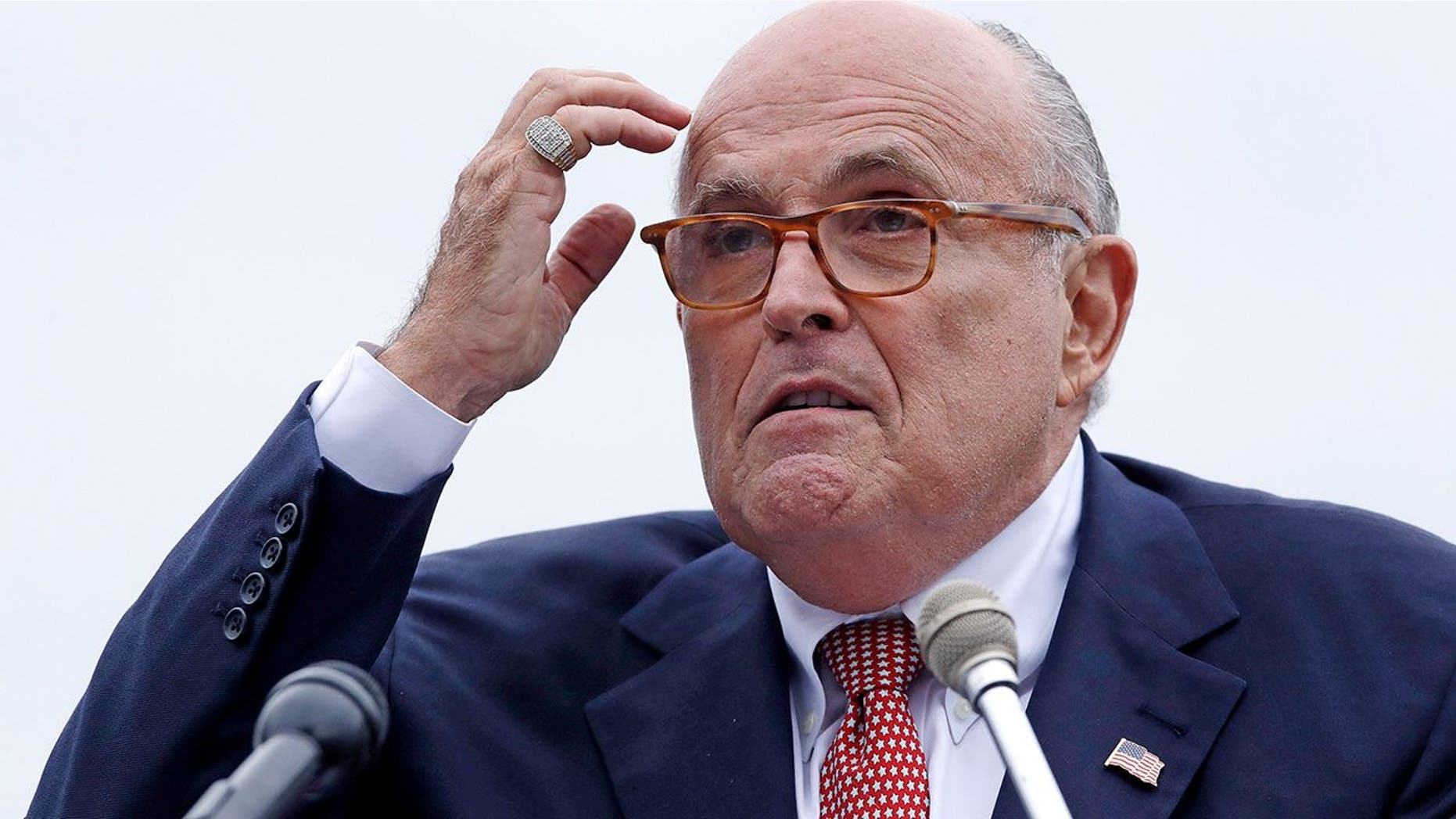 FILE - In this Aug. 1, 2018 file photo, Rudy Giuliani, an attorney for President Donald Trump, addresses a gathering during a campaign event for Eddie Edwards, who is running for the U.S. Congress, in Portsmouth, N.H. President Donald Trump will not answer any questions, written or in-person, about possible obstruction of justice, Giuliani told The Associated Press. Giulianiâs statement was the most definitive rejection yet of Special Counsel Robert Muellerâs efforts to interview the president about any efforts to block the investigation into possible coordination between his campaign and Russians. (AP Photo/Charles Krupa, File )<br>