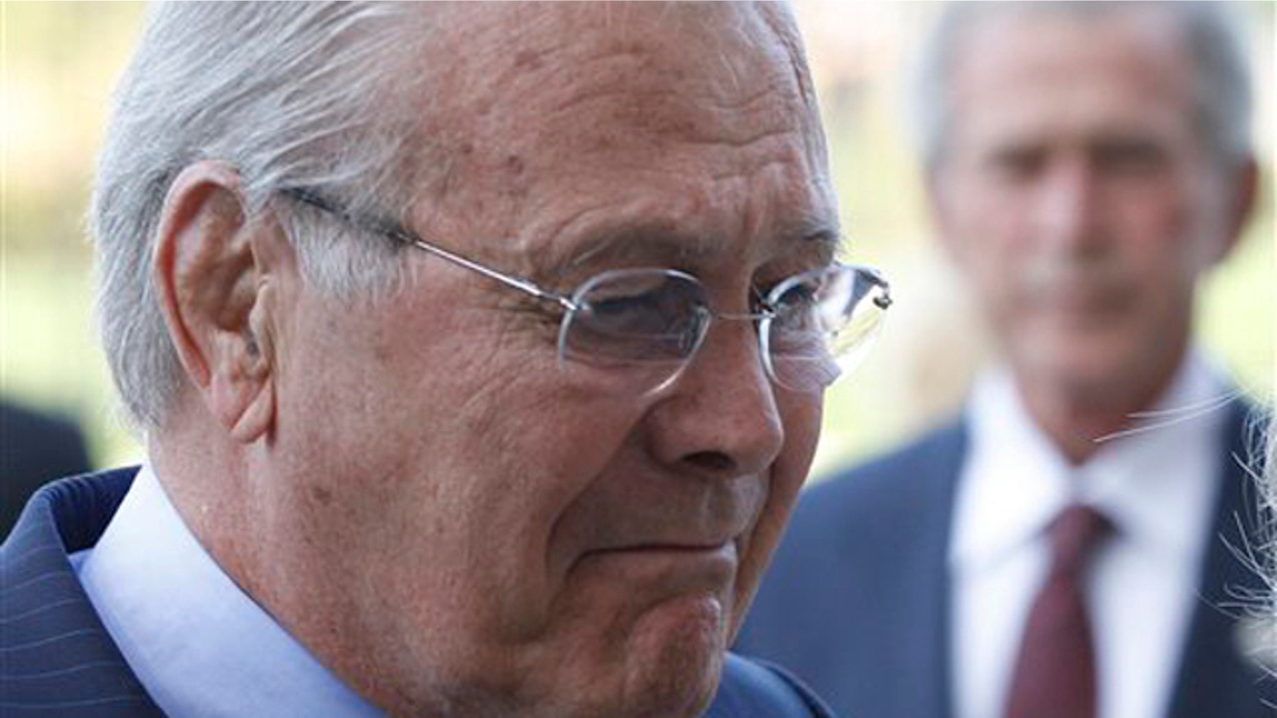 Former Defense Secretary Donald Rumsfeld and former President George W. Bush pause after laying a wreath at the Pentagon in Washington Sept. 10 in commemoration of the 10th anniversary of the Sept. 11 attacks.