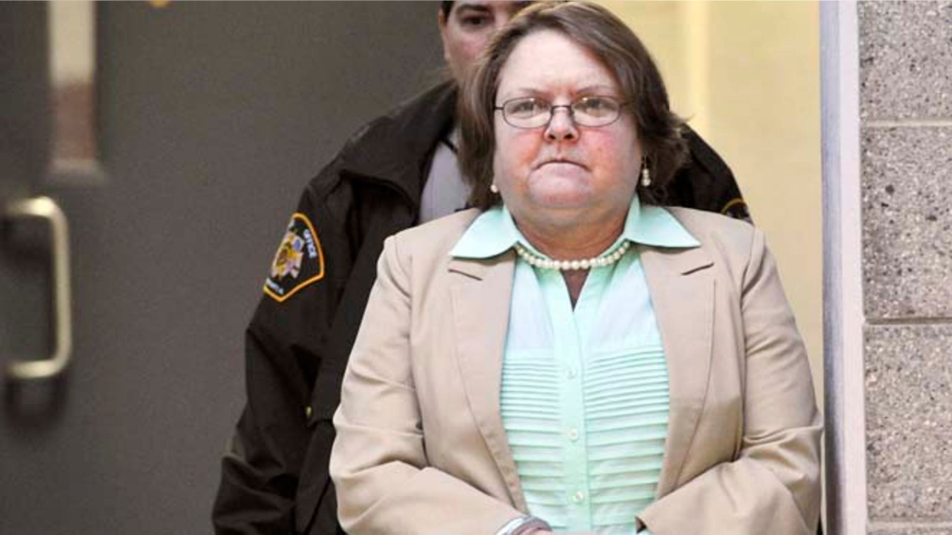 March 10: Joyce Hardin Garrard walks to the Etowah County Judicial Building from the Etowah County Detention Center in Gadsden, Ala.