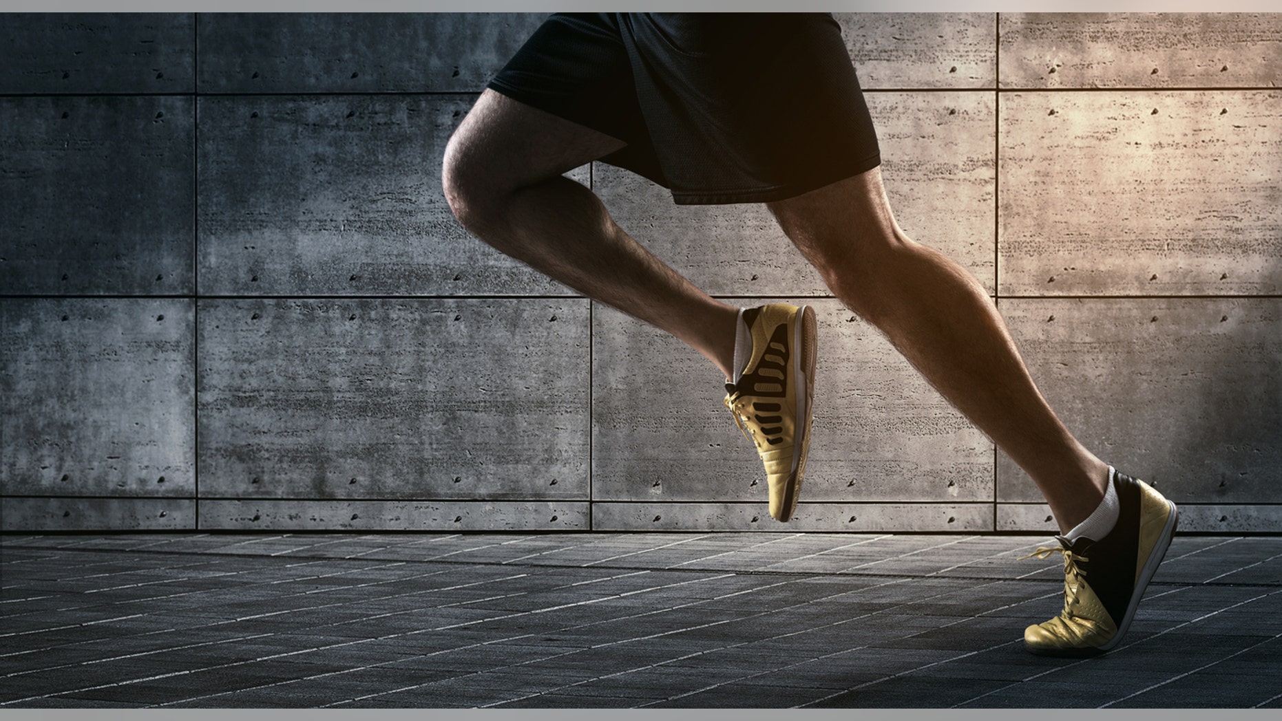 Close up of urban runner's legs run on the street with copy space