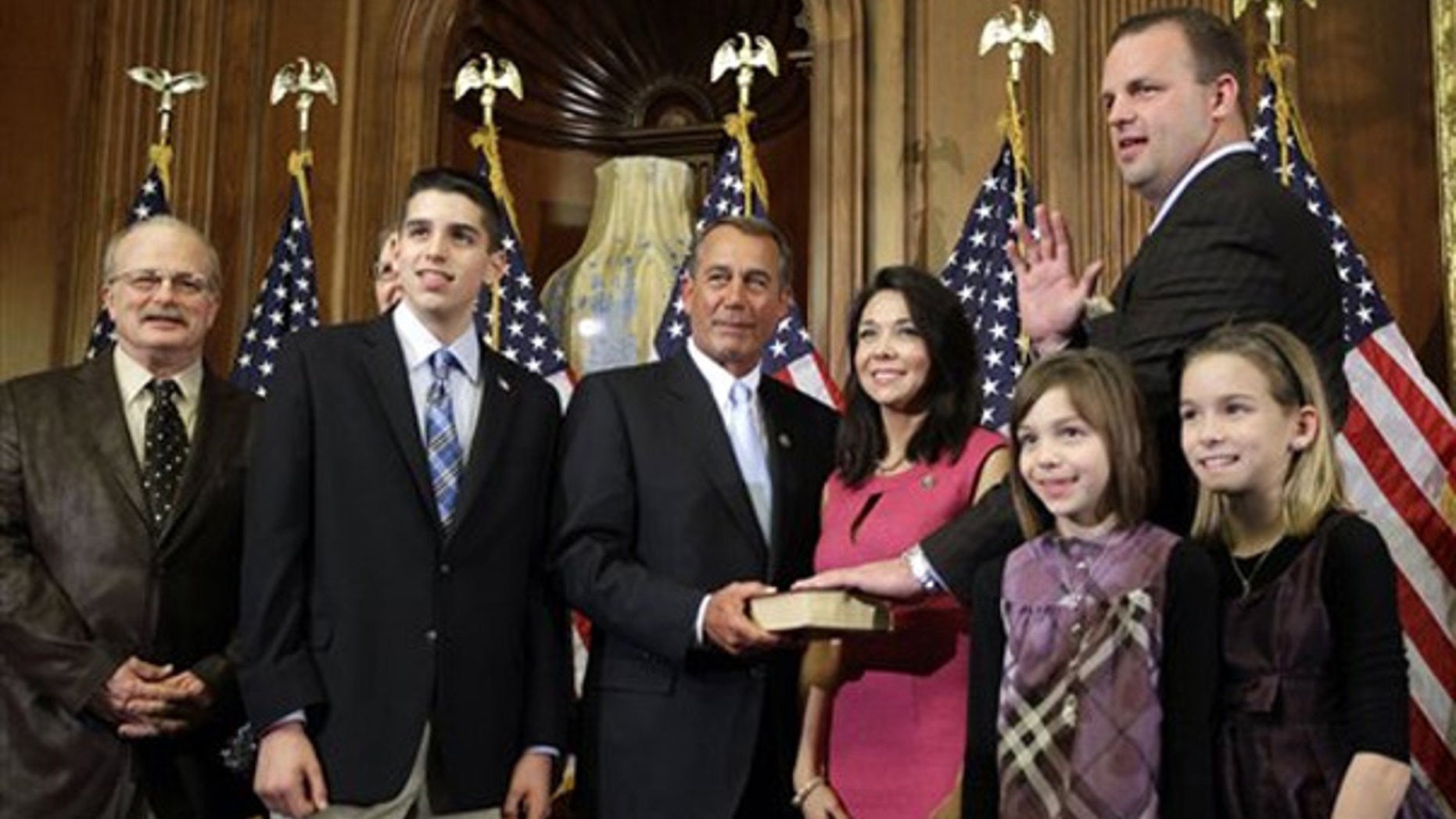 FILE: In this Jan. 5, 2011, photo, Rep. Jon Runyan, R-N.J., is surrounded by his family and House Speaker John Boehner for a ceremonial swearing-in to Congress.