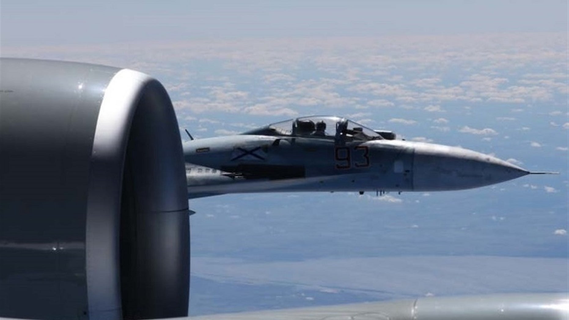 The U.S. European Command has released photos of a Russian jet flying within a few feet of a U.S. Air Force reconnaissance jet over the Baltic Sea on June 19, 2017.