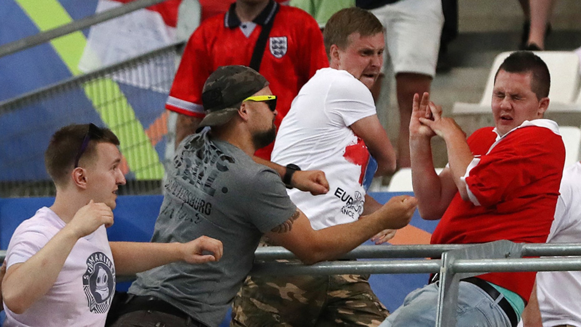 June 11, 2016: Russian supporters attack an England fan at the end of the Euro 2016 Group B soccer match between England and Russia, at the Velodrome stadium in Marseille, France.